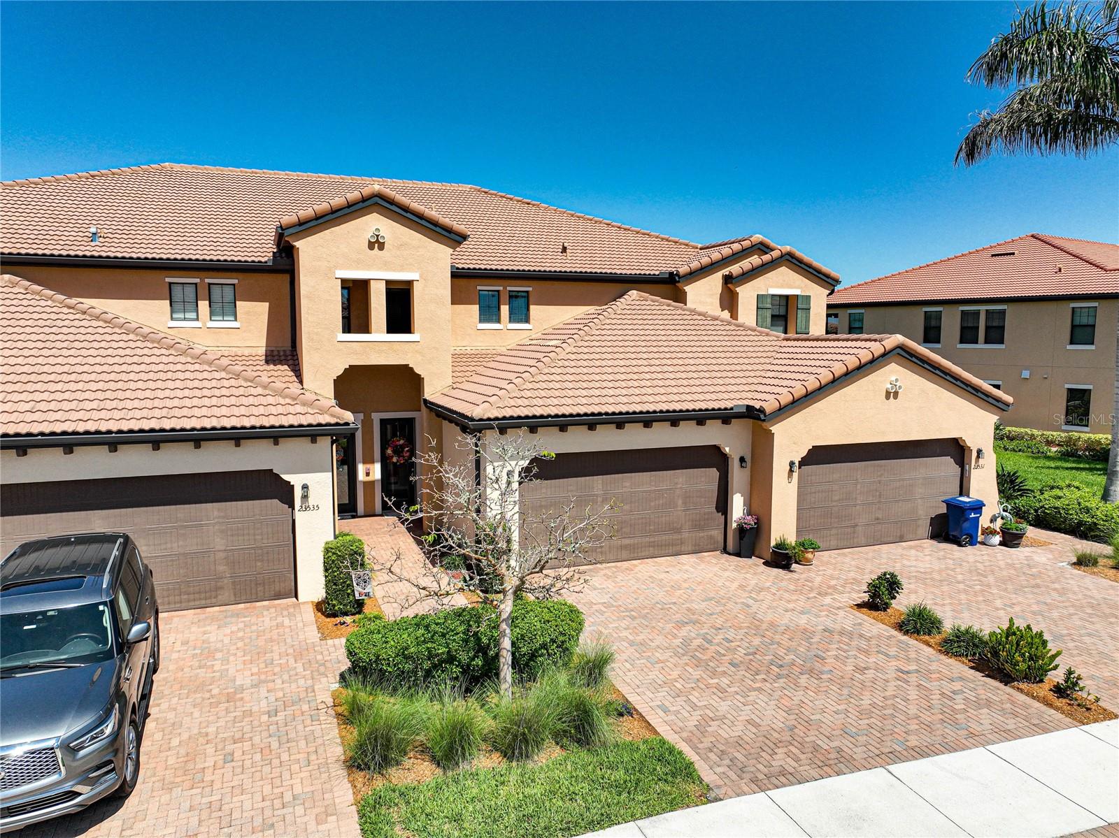 WCI Build and known for luxury quality homes. Sarasota National Turn-key Condo ready for new owners! Is that you? This condo features a Water AND Golf course view, and the view means a Golf Membership IS included. Inside you will find 2 full bedrooms with a den for your additional guests or home office/entertainment with custom French doors AND a sitting room aside from your open living and kitchen area. California Closets in the owners suite along with sleep number bed conveying. Wood flooring on stairway offers a clean entry. Lanai floor just freshly painted. Storage space added in the garage and additional fridge creates any extra storage you may need. Schedule your showing today!