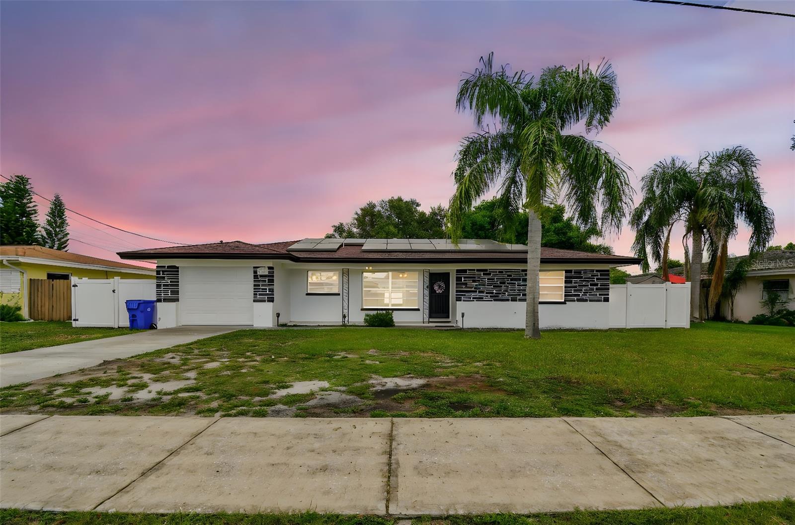 Welcome to your dream home in the heart of Dunedin, FL! This charming single-family residence, formerly known as the Halloween house, offers a unique blend of vintage charm and modern convenience. Step inside to discover beautiful terrazzo floors that flow seamlessly throughout the home. With 2 spacious bedrooms and 2 baths, this home is perfect for comfortable living. The sunroom provides a bright and airy space to relax and enjoy the Florida sunshine. One of the standout features of this property is the huge screened-in lanai, perfect for entertaining or simply unwinding after a long day. The expansive backyard offers plenty of space for outdoor activities and gardening.
The vintage kitchen adds a touch of nostalgia, while the freshly painted interior and exterior give the home a fresh, clean look. Check out the vintage in wall oven that still works and is in good condition. You'll also appreciate the ample storage space available throughout the house. Home is equipped with paid off solar panels, helping to keep energy bills low.