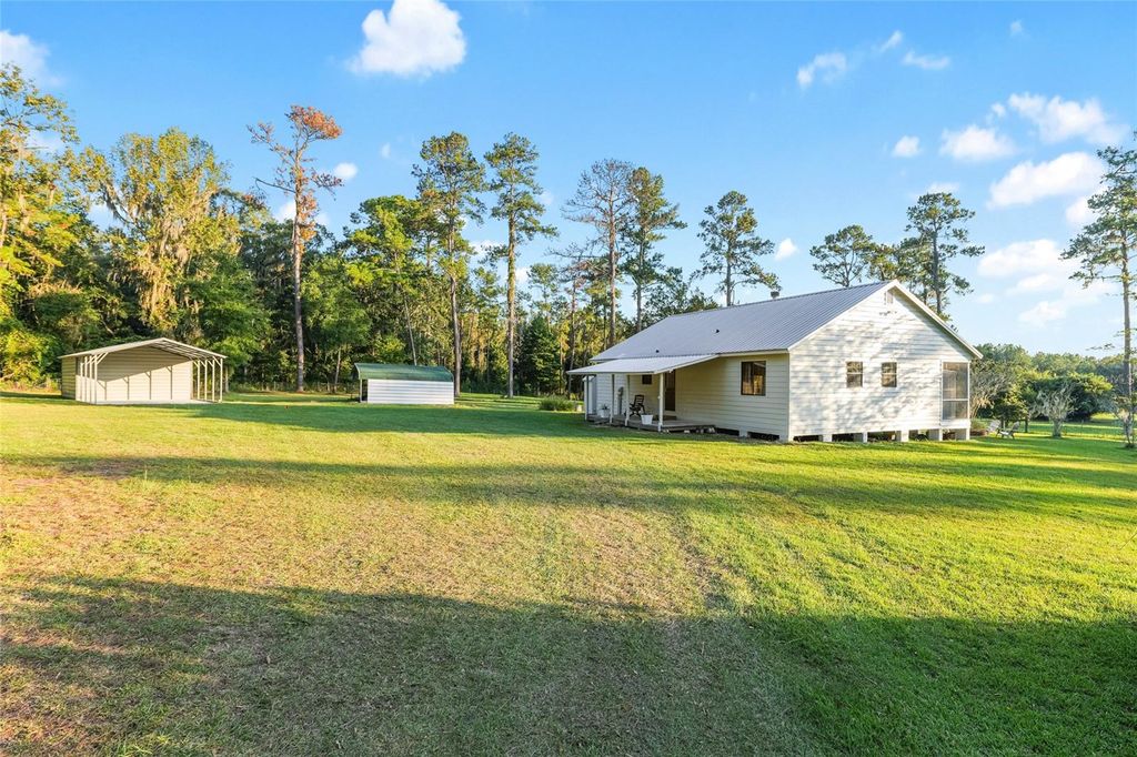 Photo of 12719 NW 88th Place, Alachua, FL 32615 (MLS # GC534885)