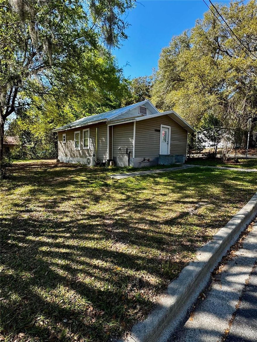 This 2-bedroom (with a small bonus room), 1-bath house is a perfect starter home right across the street from downtown Alachua. The house has a new metal roof and attic insulation (2026), new gravel driveway (2026), foundation work (2026), new tankless water heater (2025), mini split AC (2024), updated electrical (2024), and newer appliances (2024). The house was rented for almost two years at $1,200 a month making it a great investment property. Whether it’s your first home or your second investment property this cute cottage offers tremendous value and opportunity.