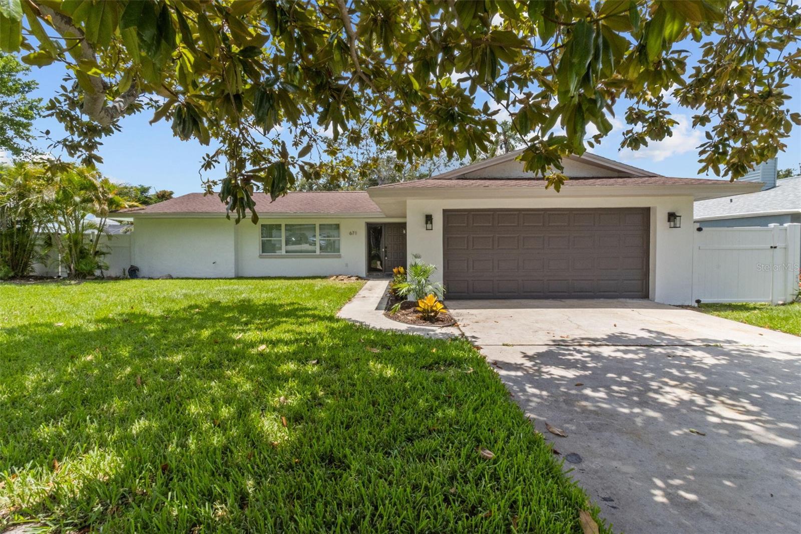 Completely renovated pool home near Belleair Bluffs. High and dry - no flood insurance required! No HOA! This stunning home features an open layout with an oversized kitchen island, quartz countertops, shaker cabinets, and stainless-steel appliances. The kitchen and dining area seamlessly connects to the living area and Florida room. Relax in your resurfaced pool (2025) with brand new equipment and a newly installed vinyl privacy fence. Also enjoy a spacious backyard beyond the pool. Dedicated laundry room inside, as well as an oversized 2-car garage. Just blocks from the Intracoastal Waterway and minutes to world-famous beaches, dining, and shopping. Don’t miss this move-in ready coastal retreat!