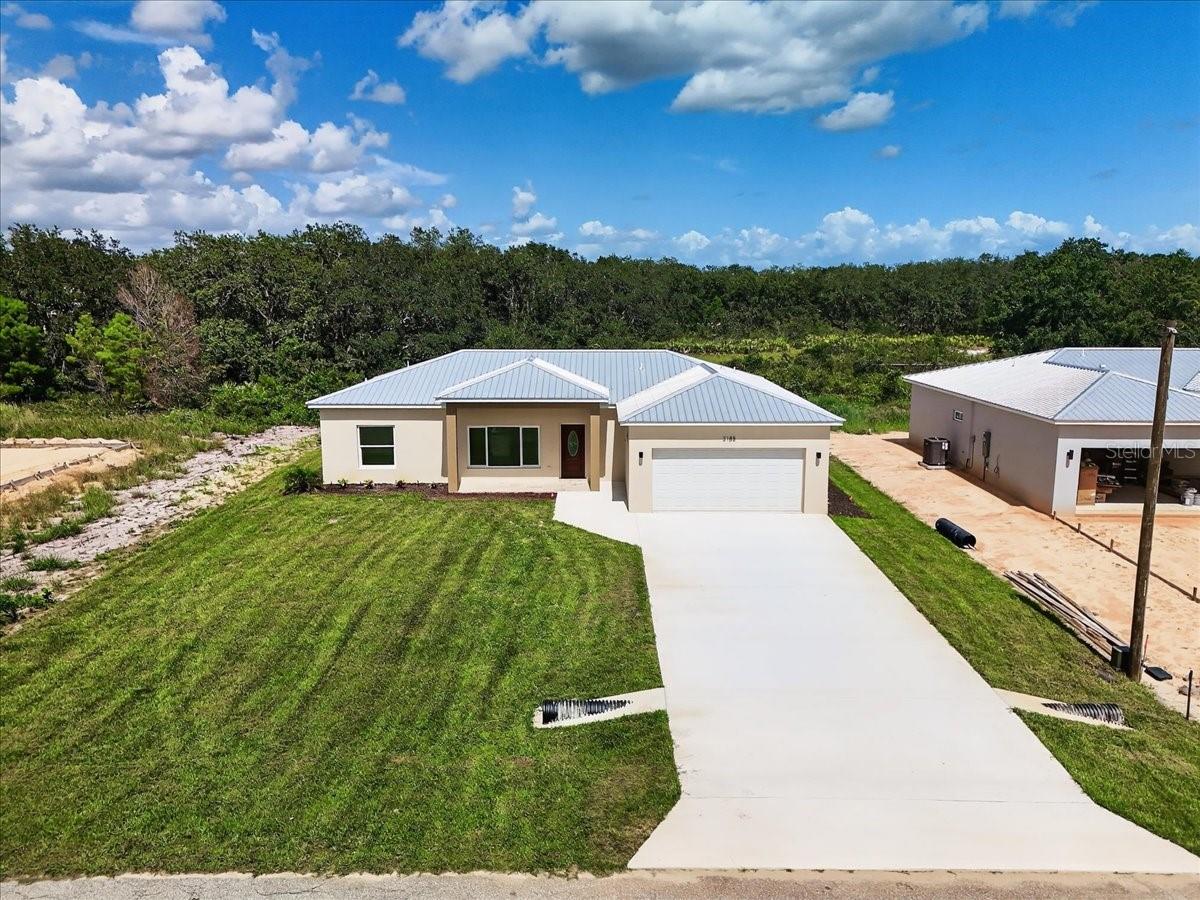 Move-in ready! This new construction home has 3 bedrooms, 2 baths in Avon Park. Open-concept layout featuring a modern kitchen with stainless steel appliances, a center island, matte fixtures, a farmhouse-style sink, and sleek finishes—perfect for everyday living and entertaining. Enjoy the split floor plan for added privacy, including a spacious primary suite with a walk-in closet and en-suite bath. The home has a durable metal roof, no HOA, fresh landscaping, and an extended driveway leading to the two-car garage. Nestled near beautiful lakes, parks, schools, and downtown Avon Park, with easy access to Sebring and U.S. 27 for shopping, dining, and commuting. Don’t miss this opportunity to own a new construction home in a growing Florida community. Schedule your private tour today!