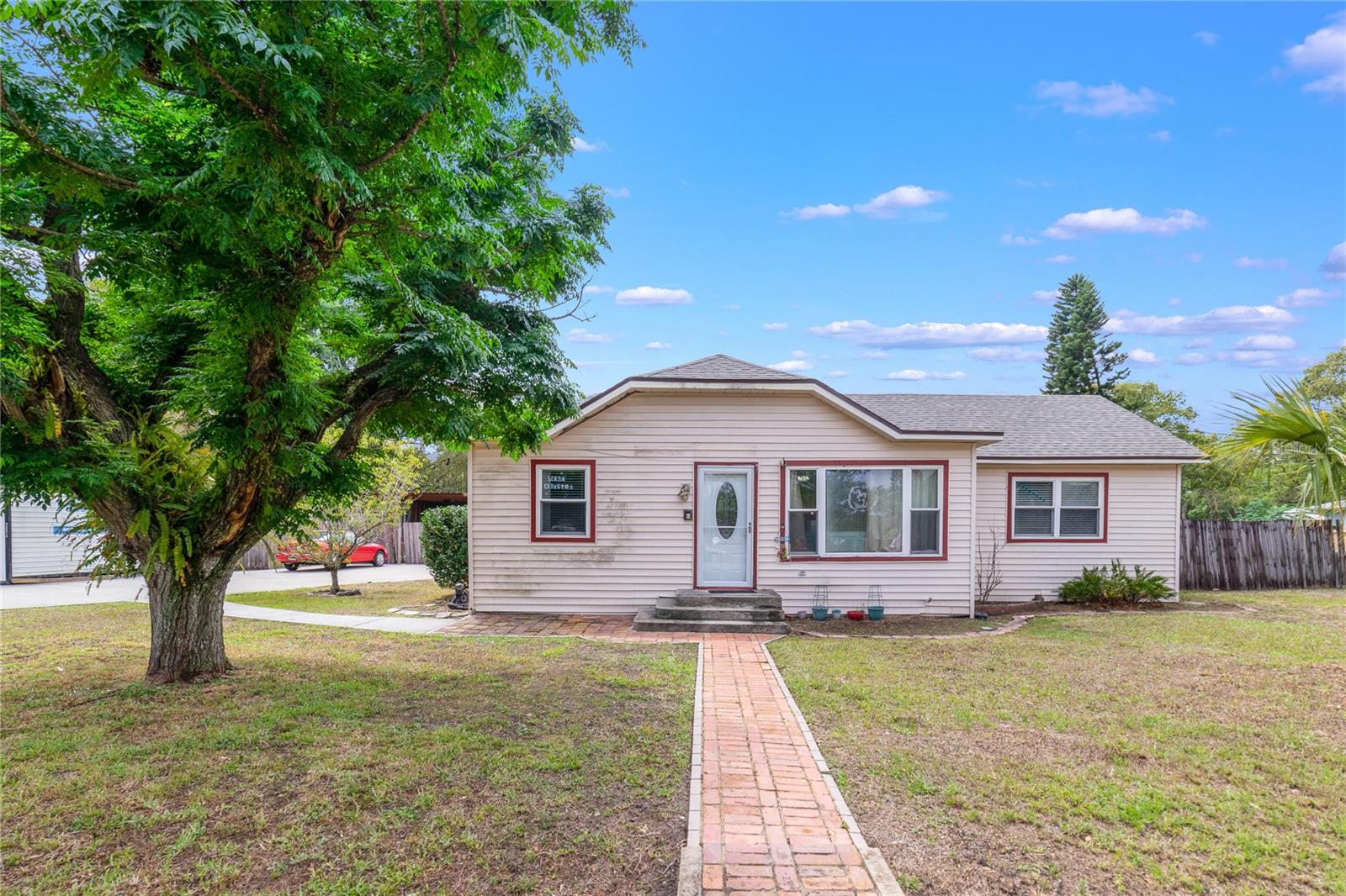 Winter Park charmer with short term/rental possibilities, a brand NEW ROOF (2023), NEW KITCHEN (2022), UPDATED A/C (2022), WATER HEATER (2023), WOOD LOOK TILE throughout and a FINISHED SHED (drywall, window a/c and electric!) on 3 LOTS for .49 ACRES! There is a lot to love about Seminole Ave, from the renovated oversized kitchen with soft close cabinets and drawers, quartz counters and new appliances to the expansive FLORIDA ROOM for additional flexible living space. The three bedrooms include a nice sized primary suite with a private bath and all have ceiling fans. This sprawling property is FULLY FENCED and includes multiple structures including COVERED RV/BOAT PARKING, a fun GAZEBO to enjoy the FIRE PIT and all with NO HOA! Electrical has been updated and septic was serviced in 2022. In desirable Winter Park, ZONED FOR SEMINOLE COUNTY SCHOOLS, and just minutes from Park Ave, Winter Park Village, shopping, dining, parks and more! Enjoy easy access to 417 and I-4. This unique opportunity won’t last long; call today for your private showing!