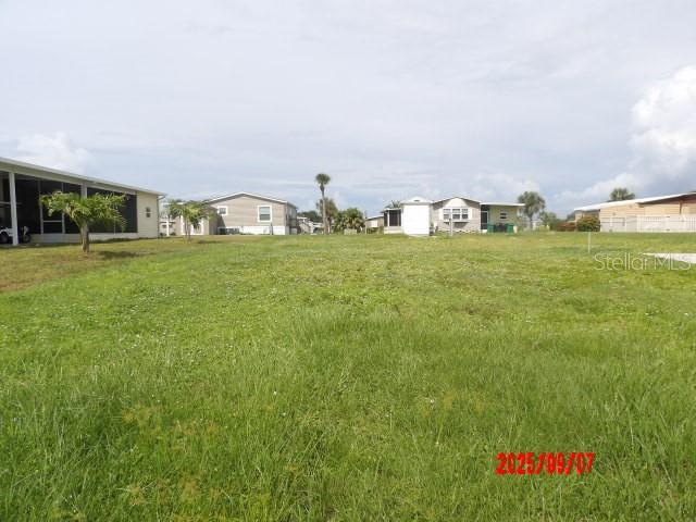 Here you have a great lot in Holiday Mobile Estates 3rd Addition in Englewood, FL. for sale.
There was once a home that is no longer there. The Seller's are still paying the Englewood Water Bill in order for the new owner's to avoid paying a nearly $15,000 impact fee when you bring in your new custom built home here.
This is a 72' X 110' lot. There is no lot rent or monthly maintenance fees in this desirable community.
The $35.00 yearly Homeowners association fee is optional.
I have been told that the usual $315. yearly fee to the Active Edgewater Clubhouse is reduced to $87.00 yearly when you don't have your h At that courtesy price you will have NO Clubhouse privileges. It just keeps you or your buyer's to avoid the $1000. Buy-in Fee.
If the full fee is paid you will have access to enjoy all the fun at The Edgewater Clubhouse.
This is optional, but you might enjoy The swimming pool, Pickleboard, shuffleboard, Tennis and more outdoor activities.
The Clubhouse has Dinner dances, potlucks, cards, arts and crafts, Themed Holiday get togethers and much more. Pet friendly and golf Carts are Welcome.
Don't miss the chance to enjoy living the Florida Lifestyle in this Adult deed restricted neighborhood.
Lots of Water around, Public Golf Courses and Public Boat Ramps in town.
Being SOLD-AS-Is, subject to buyer's approval.
All Information provided is deemed reliable, but Buyer/Buyer's Agent should verify.