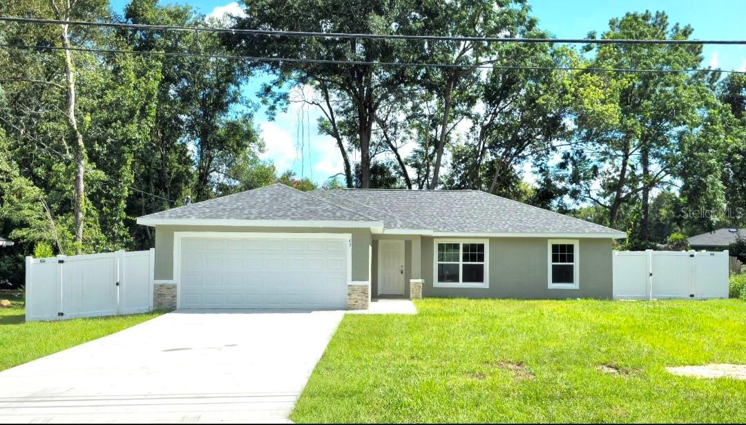 Discover this stunning brand-new home nestled in the heart of SE Ocala, offering the perfect retreat from the city’s hustle and bustle.Quartz counter tops throughout! Enjoy total privacy in your completely fenced backyard oasis! Featuring a spacious open floor plan, soothing neutral tones, and durable vinyl plank flooring throughout, this 3-bedroom, 2-bath residence delivers both comfort and style. The modern kitchen shines with shaker-style cabinetry, granite countertops, and a stainless-steel appliance package, while the indoor laundry area with washer/dryer hookup adds everyday convenience. Enjoy the charm of the neighborhood with nearby shopping, dining, medical facilities, and natural springs, and take advantage of easy access to pristine rivers and springs for endless outdoor adventures.