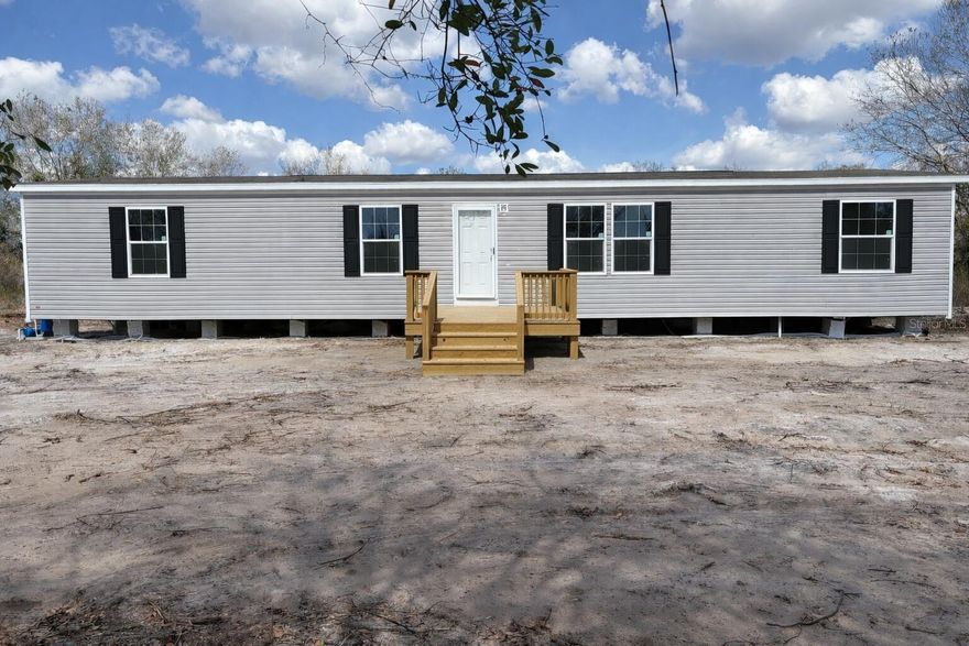 Brand-new Champion Prime 4-bedroom, 2-bath home on 1.25 acres in Viking Estates with full manufacturer warranty included. Located in Flood Zone X (no flood insurance required), this property offers affordable, low-maintenance living with the freedom of Res/ag zoning--bring your animals, barn, park your toys, and enjoy true country living. The home features a modern open layout, new appliances, energy-efficient construction, and a split-bedroom floor plan. Everything is brand new, making it ideal for first-time buyers or anyone looking for a move-in-ready home. The 1.25-acre parcel provides endless possibilities for livestock, gardening, workshops, RV/boat storage, and more. No HOA and plenty of privacy in a growing rural community.