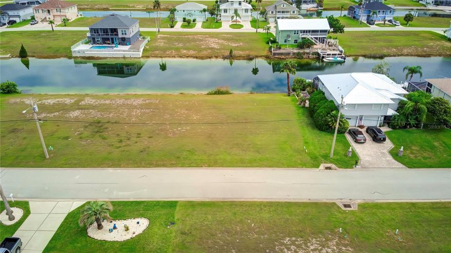 Discover the opportunity to craft your ideal home on this exceptional 75 ft x 100 ft lot, boasting a desirable rear southern exposure in the hidden gem known as Hernando Beach South. Nestled within the embrace of the Weeki Wachee Preserve, Hernando Beach is a truly unique community where the tranquil beauty of nature converges seamlessly with modern convenience.
This enchanting locale offers a delightful array of over half a dozen restaurants and shops, all within leisurely walking distance. For those seeking adventure and natural wonder, the world-renowned Weeki Wachee Springs and the pristine Weeki Wachee River are mere minutes away, promising endless exploration and recreational opportunities.
Weekends here are destined for blissful moments spent on the Hernando Beach "Flats," or perhaps, a brisk boat ride to captivating destinations such as Anclote or the Homosassa River, among many others. The best part? The modest $380 annual homeowners association fee not only includes lawn maintenance until your new abode is complete but also grants you access to the community boat ramp—a boon for water enthusiasts.
Imagine the vistas that await you from the vantage point of your dream home's third story—a panoramic spectacle encompassing the serene preserve and the sparkling Gulf of Mexico.
Don't miss the chance to create the life you've always dreamed of in this idyllic haven. It's not just a house; it's a canvas for your dreams and a gateway to an extraordinary coastal lifestyle.