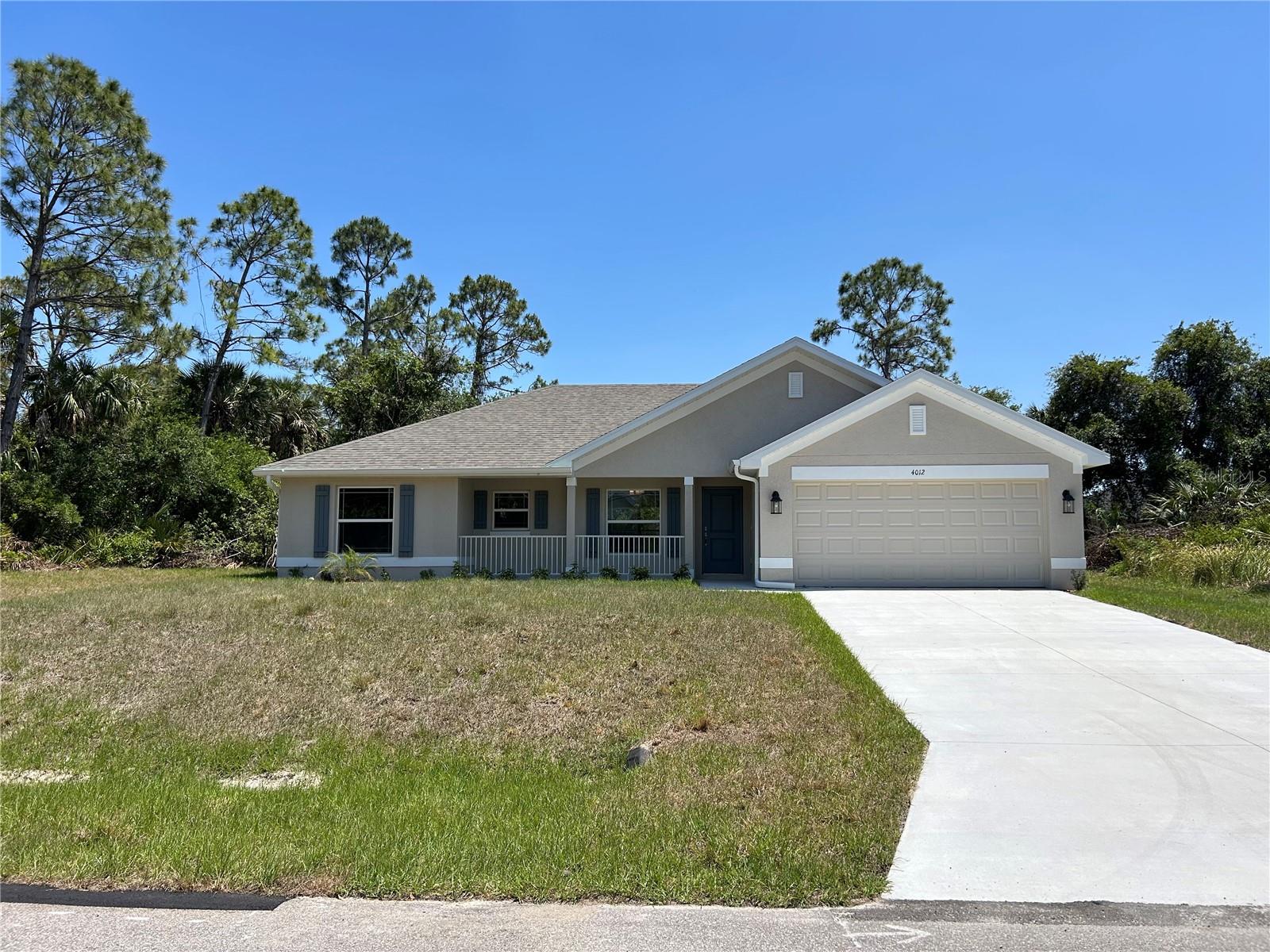 Under Construction. Welcome to your new home in beautiful North Port, Florida! This charming 3-bedroom, 2-bathroom residence with a 2-car garage offers a perfect blend of comfort and style, situated in a vibrant community known for its wonderful amenities and attractions. Designed for privacy and convenience, this split floor plan is perfect for families and guests. The spacious living room, with its vaulted ceilings, enhances the open, airy feel of the home. Ceramic tile flooring runs throughout, with plush carpet in the bedrooms providing a cozy touch. The primary bedroom is a highlight, featuring double vanities with granite tops, a walk-in closet, and an upgraded, 5 foot, fully tiled shower. The kitchen is well-equipped with stainless steel appliances, including a range, microwave, and dishwasher and granite counter tops. Quality fixtures such as brushed nickel Moen faucets, LED lighting, and 5-panel doors add a touch of elegance to the home. Efficiency is a key feature, with double pane tilt-in windows ensuring easy cleaning and lower utility costs. Additional features include 5 1/4" baseboards, upgraded painted cabinets, and a built-in pest defense system. The exterior of the home boasts a professional landscaping package, adding curb appeal and ease of maintenance. The builder offers a comprehensive warranty package, including a 1 Year Workmanship, 2 Year Systems, and 10 Year Structural Warranty for peace of mind. Most closing costs are covered with an approved lender, making your move even easier. You can secure this home with only a $1,000 deposit, and the pricing includes the lot. North Port is a thriving community with a wide array of attractions and amenities. Enjoy outdoor recreation in nearby parks, golf courses, and the Warm Mineral Springs. There is convenient access to local shops, restaurants, and cafes, and some of Florida’s best Gulf Coast beaches are just a short drive away. This family-friendly area boasts excellent schools, community centers, and numerous activities for all ages. Additionally, you’ll be close to top-notch medical facilities and services. Don’t miss the chance to own this incredible home in one of Florida’s most desirable, growing communities. Schedule a viewing today and make this North Port gem your own!