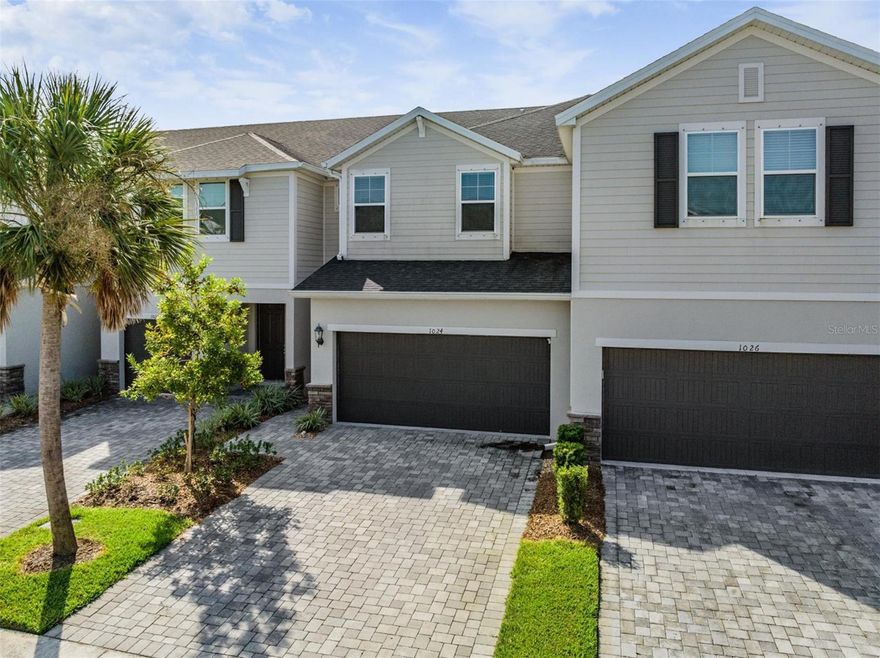 Gated Community -Built in 2020- Like NEW Construction! 3 Bedroom/2.5 Bathroom Townhome with 1801 Ht. Sq. Ft. of Living Space. 2 car garage with pavered driveway and front walkway. This Energy-Efficient Townhome in Bearss Landing has a beautiful Community Pool area with lots of seating- open and in covered cabana area.  Guest parking and mailboxes in the same location. There is even a dog walking park. LOW HOA fees and NO CDD. Open Concept Living. Kitchen with White Shaker Style Cabinets and center island, Black Granite Countertops, SS Appliances and closet under stairs storage. Kitchen Opens to large living dining area and sliders to rear covered screen porch. ½ bath on the first floor. ALL 3 Bedrooms are Located on the 2nd Floor.  Primary bedroom suite with walk in closet &  en-suite bath including walk in shower and double vanity.  Split bedroom plan with 2nd and 3rd Bedrooms on the other side sharing the Hall Full Bathroom. Laundry is also on the 2nd Floor! Lots of Shopping and Restaurants Mins Away along with beautiful Northdale Park.  Easy access to 275 and downtown Tampa. LOCATION, LOCARION, LOCATION- Tucked in the quiet rear section on a dead end street. Move in Ready!