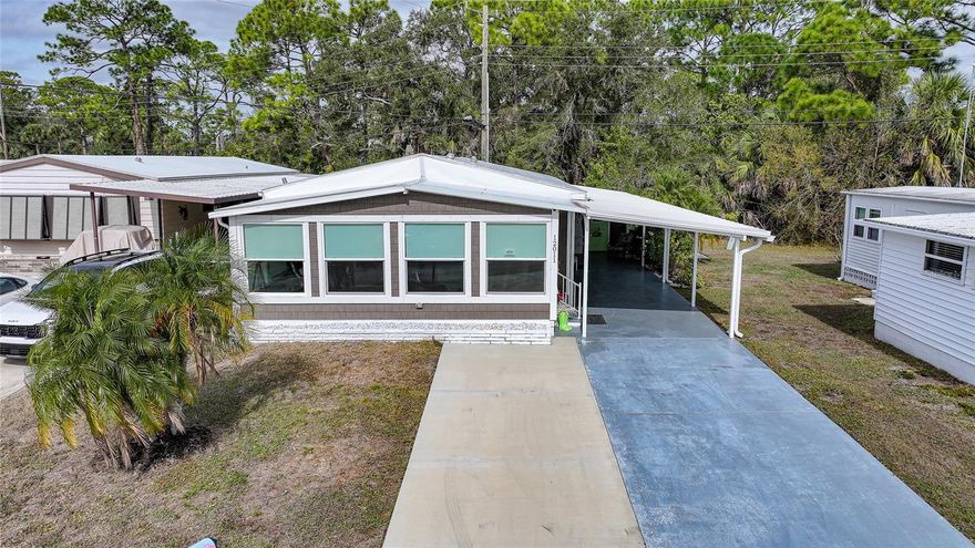 Honey, this is THE ONE! Fully remodeled and meticulously cared for by a long-term owner, this home is offered fully furnished. Styled with warm, coastal charm and a clean, modern feel. FEATURES: 2 bed, 2 bath, over 1200 sq feet of living space. Roof: Lanai, Carport, and Shed 2025, New wider HVAC ducts for more air flow 2025, Carport 2025, Updated Kitchen and Bathrooms, Stainless steel appliances, and quartz countertops. Main Roof 2018, A/C 2018, Electrical Panel 2018, Re-piped 2018, wood plank flooring in main living area, New Interior doors with matching hardware. Vapor Barrier 2018 and Tie Downs, New Windows, Extra-long driveway with additional parking pad, 2 sheds, paved patio. Large primary bedroom featuring an ensuite bathroom with an oversized, widened walk-in shower. Spacious guest bedroom with a king-size bed, ample closet space, and built-in drawers for added storage. Welcoming and bright sun room filled with natural light, perfect for morning coffee or comfortably hosting overnight guests. City water and sewer. $99 a year land lease, NO HOA fees, NO LOT rent. Resort-style amenities with two sparkling heated pools, a relaxing spa, a well-equipped fitness center, a clubhouse overlooking the stunning marina, shuffleboard, horseshoes, pickleball, tennis, and bocce courts. Socialize and stay active with dances, parties, water aerobics, fitness classes, art classes, woodworking, golf cart parades, bingo, dances, and more. Boat clubs, a craft room, picnics on the patio, golf clubs, bowling clubs and much more. There is plenty of wildlife to enjoy in this 190-acre community; herons, egrets, cranes, ibis, parrots, even alligators and manatees! Conveniently located within minutes of Downtown Wellen Park, Costco, shopping, restaurants, and a short drive to beautiful Gulf Beaches. Schedule a viewing today and let this dream home become your reality!