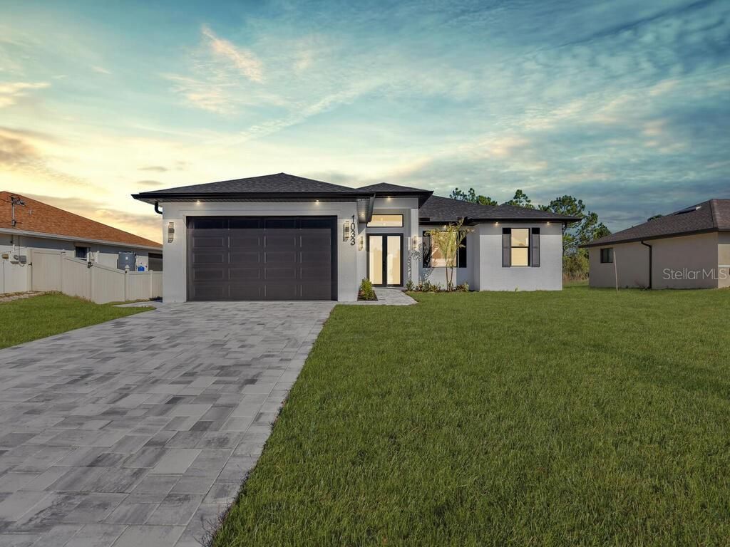 Photo of 1033 Bassinger Avenue S, Lehigh Acres, FL 33974 (MLS # C7521590)