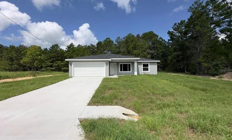 Photo of 122 Malauka Loop, Ocklawaha, FL 32179 (MLS # O6413521)