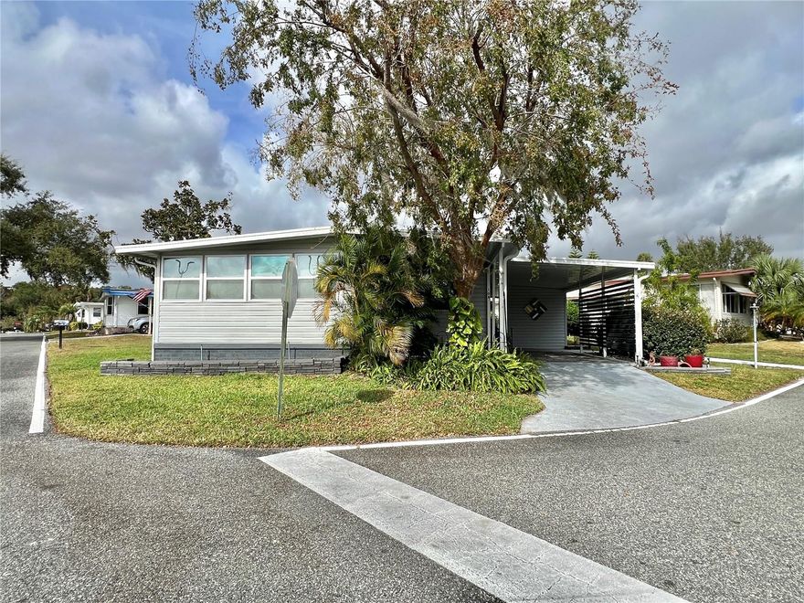 One or more photo(s) has been virtually staged. Perfectly positioned directly across from the clubhouse amenities, this move-in-ready home offers the ideal blend of comfort, quality, and convenience. Nearly every inch has been improved or upgraded between 2022 and 2025, and it truly shows. Step inside to find luxury vinyl plank flooring paired with ¾-inch upgraded subflooring, fresh paint, drywall ceilings with knockdown texture, and crown molding throughout. The bathrooms feature modern sinks, faucets, mirrors, updated lighting, and water-resistant ceilings. The home is equipped with a tankless water heater, energy-efficient double-pane windows, new vinyl siding, and multiple new Whirlpool and LG appliances. Upgrades extend outside with enhanced landscaping, stack-stone accents, painted driveway, a concrete patio, and additional covered golf-cart parking. All major systems have been inspected, including the roof, tie-downs, and vapor barrier, giving future owners added peace of mind. This is a rare opportunity to own a fully updated home in a highly desirable community at an exceptional value.............Hawthorne at Leesburg is an active, resident owned, 55+ cooperative, waterfront, gated community, with beautifully landscaped grounds, lakes with illuminated fountains and a relaxing and comfortable gazebo. The affordable monthly maintenance fee of $346 includes water, sewer, lawn mowing, private emergency services and storage space for recreational vehicles, boats, trailers and much more! The beautiful clubhouse is complete with a full-time program coordinator, more than 100 different activities and seating for 550. It has a hospitality lounge, card rooms, craft rooms, billiard room, fitness center, library, fine arts room and many more. There is excellent fishing, outdoor geo-thermally heated pool and two enclosed therapeutic pools. Hawthorne boasts a private marina monitored by an electronic security system with over 120 boat slips and access to the Harris Chain of Lakes and beyond.