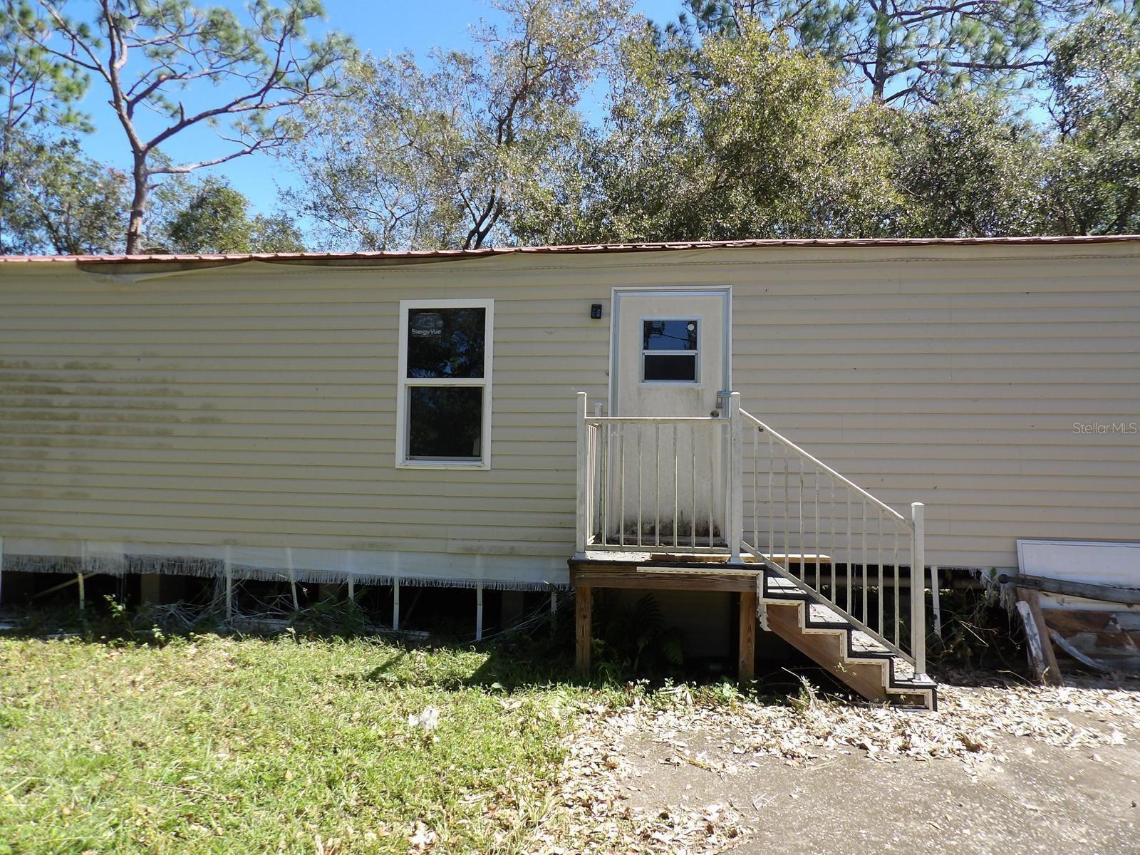 Welcome to this charming double wide mobile home located in the serene setting of Lakeland, FL. Nestled on a spacious lot, this property has a comfortable and inviting living space with ample natural light throughout. The home features a well-appointed kitchen, cozy living area, and generous bedrooms. Enjoy outdoor living with a private yard appropriate for relaxation. Conveniently located near local amenities and with easy access to major roadways, this home provides a peaceful retreat with modern conveniences.