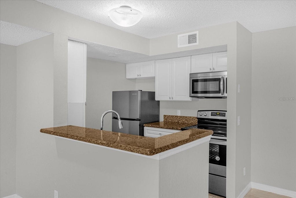 Photo of 5132 Conroy Road #928, Orlando, FL 32811 (MLS # S5159014)