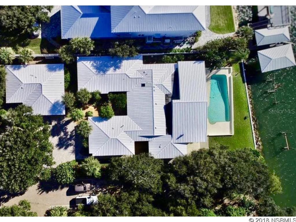 Mesmerizing river views & sunsets from this tastefully remodeled 1962 ranch style river home. Numerous upgrades maintaining the homeâs character & charm will be seen throughout the sprawling Florida single story. 5 beds & 6 baths includes the bed/bath in guest house. Newly polished terrazzo floors in kitchen & main living areas. Amazing views of the river throughout, although the views from the 56âx23â climate controlled Florida Room with floor to ceiling windows are breathtaking. Formal dining room overlooks the river with oak flooring and a large picture window. All kitchen appliances have been upgraded, including the 5 burner natural gas cooktop, and complement the mid century cabinetry. An enormous master suite faces the river and features a 7âx12â closet custom designed by Top Drawer. Bath features large bubble tub, dual vanity, granite tops & huge shower with dedicated high flow gas water heater. Guest wing of main house includes 3 large bedrooms set up as suites each with their own bathroom(one handicap accessible). Theater room; engineered for perfect picture and sound via the Marantz Home Theater System, 110â JVC projector and Klipsch speakers(over $30k in upgrades). What a great place to unwind after a tough day at the beach, on the river or relaxing at your pool. 5 HVAC systems and plantation shutters throughout to keep you comfortable. Room for friends and family in the newly remodeled guest bungalow; and room for your toys in the oversized 2-car garage. This IS NOT your typical river home. A MUST SEE. ;Water: City