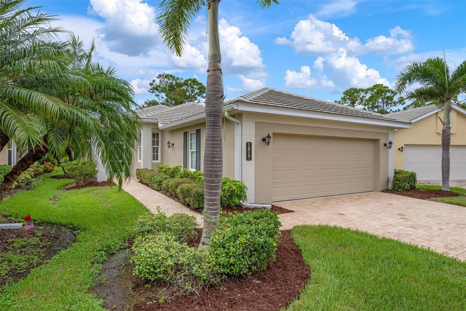 Privacy meets Convenience in this Hidden Retreat. Beautifully cared for and maintenance free, this home is ideally positioned near the end of a quiet cul-de-sac in the enclave of St. Andrews East at Plantation Golf & Country Club. Designed with a sunlit open layout and coveted southern exposure, the residence offers a seamless blend of elegance and comfort. The kitchen is a showpiece with canvas-toned cabinetry accented by cocoa highlights, quartz countertops, multiple deep drawer banks, glass tile backsplash, under-cabinet lighting, granite sink, and stainless steel appliances including a double wall oven and induction cooktop.
The expansive great room impresses with a trayed ceiling, crown molding, 8-foot interior doors, and plantation shutters, all leading to a wall of sliders that open to the generous lanai and pool. A covered outdoor living area overlooks the extremely private heated saltwater pool and the lush Florida landscape beyond. The luxurious primary suite features dual walk-in closets and a spa-inspired ensuite bath with dual sinks and a curbless walk-in shower.
This residence is equipped with excellent storm protection, including impact-resistant windows, accordion shutters, and a security system. Additional highlights include a finished garage, extra laundry cabinetry, and a whole-home water filtration system.
For those seeking an active lifestyle, the Plantation Golf & Country Club offers two championship golf courses, pickleball, tennis, a resort pool with a cabana bar, a fitness center, and a variety of dining options, all supported by a vibrant social calendar. Optional memberships are available. Conveniently located just 15 minutes from Gulf beaches, historic downtown Venice, downtown Wellen Park, and abundant shopping and dining, this home perfectly combines privacy, style, and convenience.