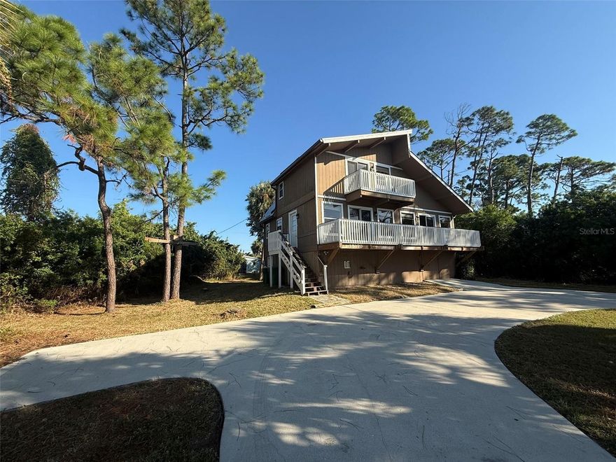 Are you tired of renting cookie cutter houses?  Do you want a rental home that is as unique as your style?  Look no further than this 3 bedroom 2 bathroom 3 story home. You enter this home on the second floor.  This home features balconies off of the living room, dining room, and front upstairs bedroom.  Exposed wooden beams.  Relax on your rear deck overlooking your semi wooded backyard.