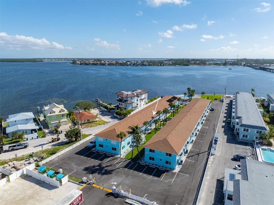 ****Check out the fresh new look outside and a lower price**** The Condo exterior renovations are complete, and all assessments have been paid by the seller. Welcome to the Bay View Terrace Condominiums, a secluded 40-unit complex overlooking beautiful Anna Maria sound.  It is accessible at the end of 7th St N in Bradenton Beach behind an electric gate. Although not a monitored gated community, it does provide privacy and prevents beachgoers from parking in the property. The complex is walking distance to all the restaurants and shopping in Bradenton Beach. There are stops for the free island trolley close by. This trolley gives you access up and down the island. The complex has an in-ground pool and patio overlooking the intercoastal. Alongside the pool is a community gas grill for the guests use. There are community kayak storage racks for use by the residents and their guests. The property had a brand-new seawall installed in 2019. From here you can watch Manatees and Dolphins in the blue waters of Anna Maria Sound. But enough about the complex, let’s talk about your new home away from home. The condo is located on the second floor and was totally and completely unaffected by the hurricanes of 2025. The front of the condo faces to the southwest, filling the unit with sunshine every day. When you enter the home, you are welcomed by an open-floor plan connecting the kitchen, dining area and living room. There is a breakfast bar between the kitchen and dining area. These renovations were done approximately 10 years ago. The home has one bedroom and one full bath. In the bedroom is a sliding glass door leading to a private balcony that overlooks Anna Maria Sound to the northeast. On a clear day or night, you can see the Sunshine Skyway Bridge off in the distance. The home is being sold turnkey furnished as you can see in the photos. Outside the door to your left is a community storage room where the unit has a locked floor to ceiling storage bin for your use. There is also a coin operated laundry room directly beneath your condo making it easy to access. The condo association is self-managed and has one of the lowest quarterly fees on the island. These fees cover almost all of your amenities. The association has completed all the renovations bringing the complex back to better than its original glory. The stairs and walkways are redone and covered with non-slip epoxy surfaces. The building exteriors are being painted. The parking lots were completely resurfaced and painted to identify the unit parking spaces. The fences are being replaced, and the remote-controlled electric gate is being renewed. Finally, the complex landscaping has been completely redone with new sod, new irrigation, new Florida friendly plants and manicured stone shrub beds. Thw whole place looks better that new!!!!