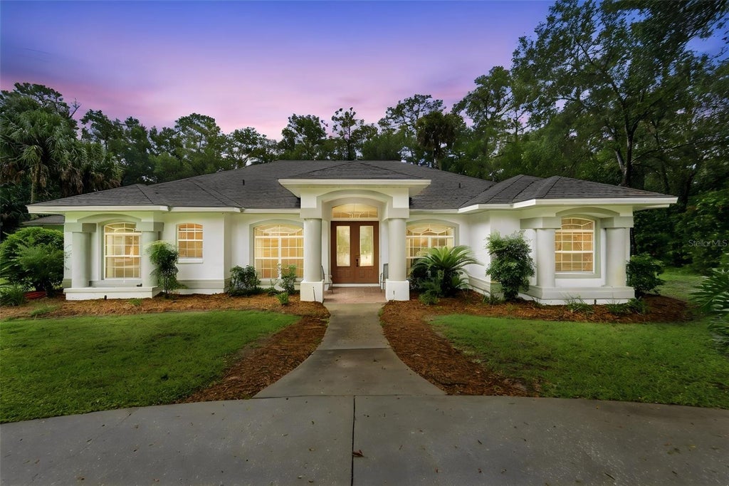 Photo of 1830 Glenwood Oaks Lane, Deland, FL 32720 (MLS # V4950955)