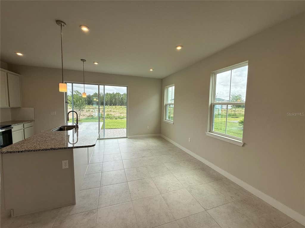 Photo of 1253 Pineywood Field Drive, Davenport, FL 33837 (MLS # W7885330)