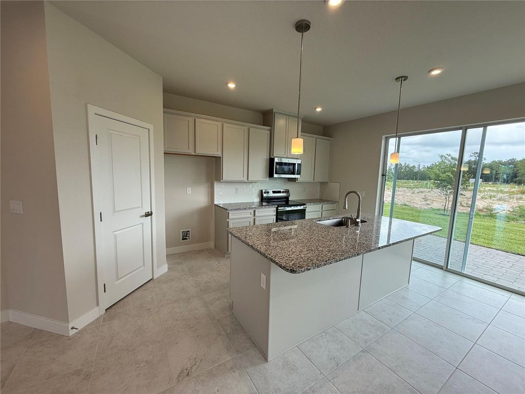 Photo of 1253 Pineywood Field Drive, Davenport, FL 33837 (MLS # W7885330)