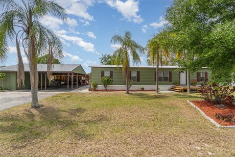 Photo of 1300 Riverview Drive, Moore Haven, FL 33471 (MLS # O6317039)