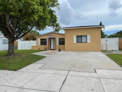 Stunning house centrally located in mid Pinellas County. not in the flood zone but close to beaches, shopping, restaurants and major roads. Its feature includes 3 bedrooms, 2 bathrooms, split floor Plan, large back yard with shed, new vinyl luxury plank flooring and baseboard throughout. New range, roof replaced in 2019, the shed installed in 2024. Freshly painted inside. double concrete driveway and sidewalk. No HOA, no rental restrictions.