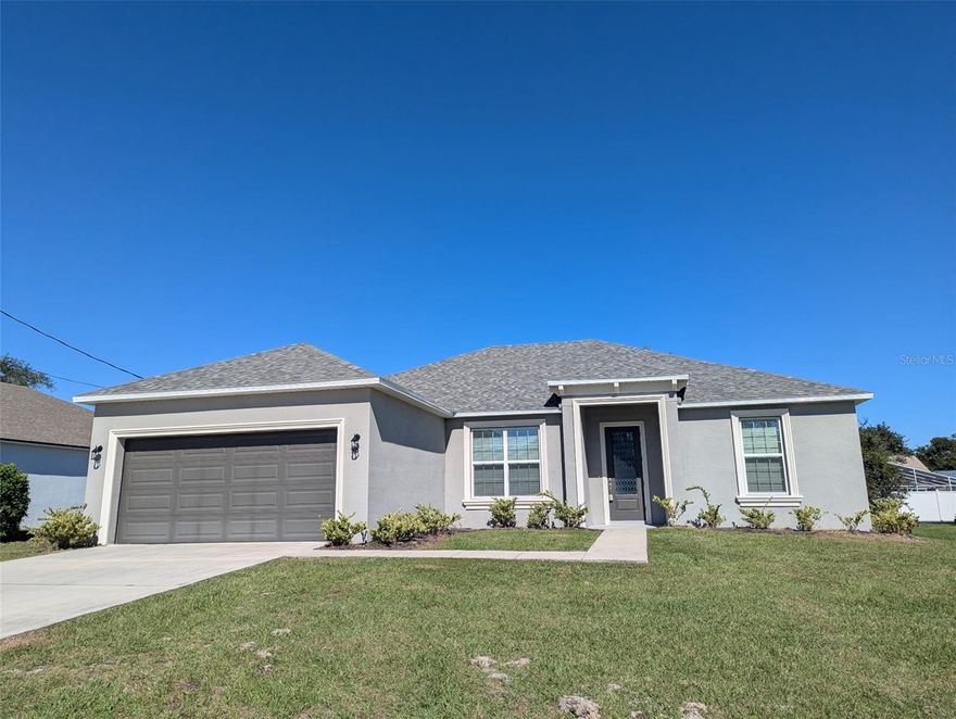 This fabulous 2022 built Landsea home features an open floor plan drenched in natural light! With 3 bedrooms plus a bonus flex room the layout is very adaptable. The kitchen offers 42" cabinets, sink on the granite island with plenty of room for seating, stainless steel appliances and separate a cook-top. The primary room features a frameless glass shower and all of the bathrooms are tile (not fiberglass or plastic), the owner had the dining nook expanded to accomadate larger furniture, added the coffered ceilings and tiled throughout. The home is located in a prime area of Palm Coast's Palm Harbor neighborhood which allows quick access to several beaches as well as a retail and restaurants. No HOA or CDD fees.