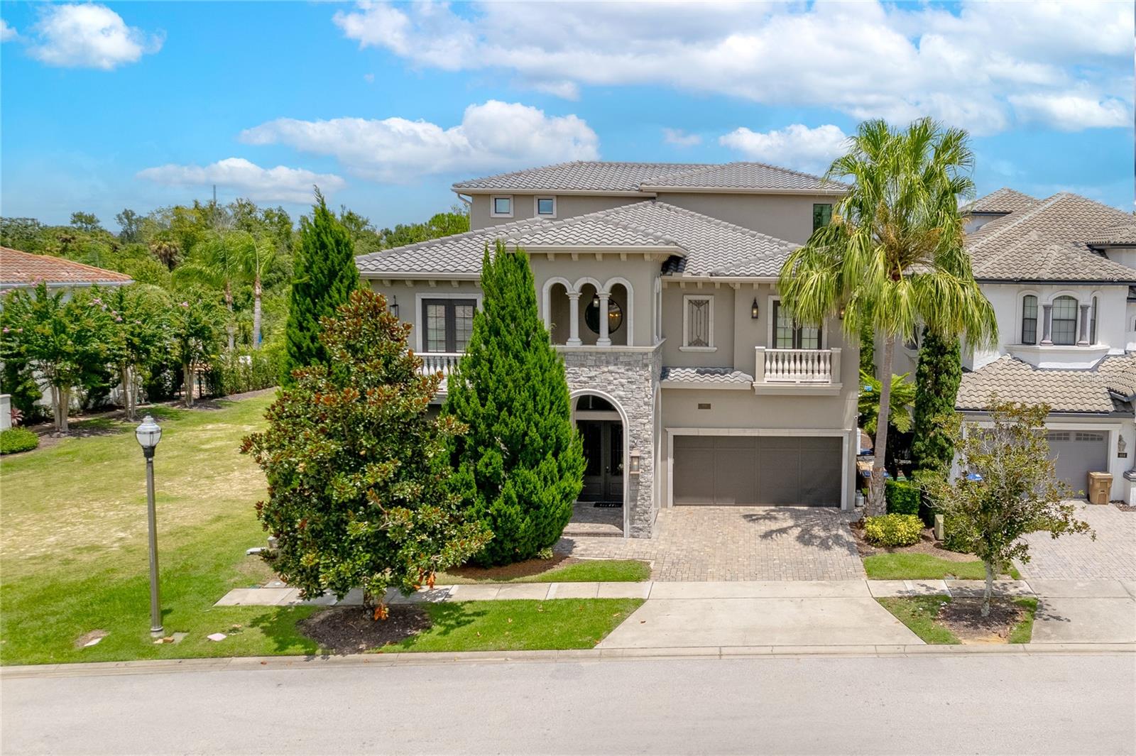 Ideally situated on a PRIME LOT in the highly desirable and award-winning REUNION RESORT, this CUSTOM-BUILT estate home boasts panoramic views of lush NATURAL WOODLAND with POND backdrop providing both scenic beauty as well as PRIVACY. No rear neighbors! Professionally designed & decorated over 3 floors and with high end features abound, this FULLY FURNISHED & TURNKEY home is perfect for entertaining family & guests on a large scale with VERSATILITY OF USAGE from a primary residence, second/vacation home and/or investment property! This home comes with an IMPRESSIVE BOOKINGS CALENDAR if kept in the existing short term rental program. As soon as you step inside the entryway, the double heighted soaring ceiling of the foyer immediately sets a scene of GRANDEUR and allows for plenty of natural light. At the heart of the home is a vast OPEN-PLAN CONCEPT living area comprised of the gourmet kitchen (which is a chef’s dream with expansive center island, high-end stainless-steel appliances and breakfast bar seating for 6), enhanced by a dining table area (which comfortably seats 18) and spacious but comfortable lounge sitting area. Comprised of 9 well-appointed primary bedroom suites and 2 distinguished bespoke themed bedrooms (Harry Potter and Princess inspired), all with ensuite bathrooms, this SPECTACULAR RESIDENCE can comfortably accommodate up to 24 guests. Awaiting your enjoyment, there are multiple casual living areas as well as lavish entertaining lounge spaces to relax, socialize, watch a movie or for those who prefer, a night of gaming! For your added convenience, there is also a RESIDENTIAL ELEVATOR. Ample AMENITIES include a dedicated arcade room, a home theater (seating 13), a secret hidden hide-away gaming room (flanked each side by the themed bedrooms) and loft office style area. Designed to take full advantage of Florida lifestyle living, the RESORT-STYLE outdoor area is a PRIVATE OASIS with both covered lanai and open sun patio space - highlights include a spectacular heated INFINITY EDGE POOL with spillover SPA, WATERFALL with GROTTO, a pool SLIDE as well as swim up in-pool bar stools, well-equipped summer kitchen, FIREPIT, plentiful lounge & enjoyment spaces and outdoor bathroom. Seamlessly blending the indoor with the outdoor and further complementing the home, there is access to multiple private balconies overlooking both the pool area and the stunning sweeping views. Flexibility has been preserved in the GARAGE, a rare occurrence in the community, which also serves as a basketball half-court. Other features of the home include a SONOS sound system, 2 dedicated independent laundry areas and plenty of closet & storage space throughout. An ACTIVE TRANSFERRABLE MEMBERSHIP grants access to the many amenities of the Reunion Resort with its three world class golf courses (designed by Arnold Palmer, Tom Watson and Jack Nicklaus), a golf academy, Clubhouse at The Bear’s Den, six onsite restaurants, twelve community swimming pools, a multimillion-dollar water park, Har-True tennis courts, pickleball, bocce ball, volleyball, crazy golf, a playground, full-service salon and spa. Reunion is conveniently located a couple of miles away from Walt Disney World Resort, Seaworld and Universal Studios. Video as well as 3D virtual tour and floorplan available! DON’T MISS OUT, schedule your private showing today!
***ADDITIONAL OPPORTUNITY: Adjacent homesite at 594 Muirfield Loop is also available for purchase MLS # O6335453***