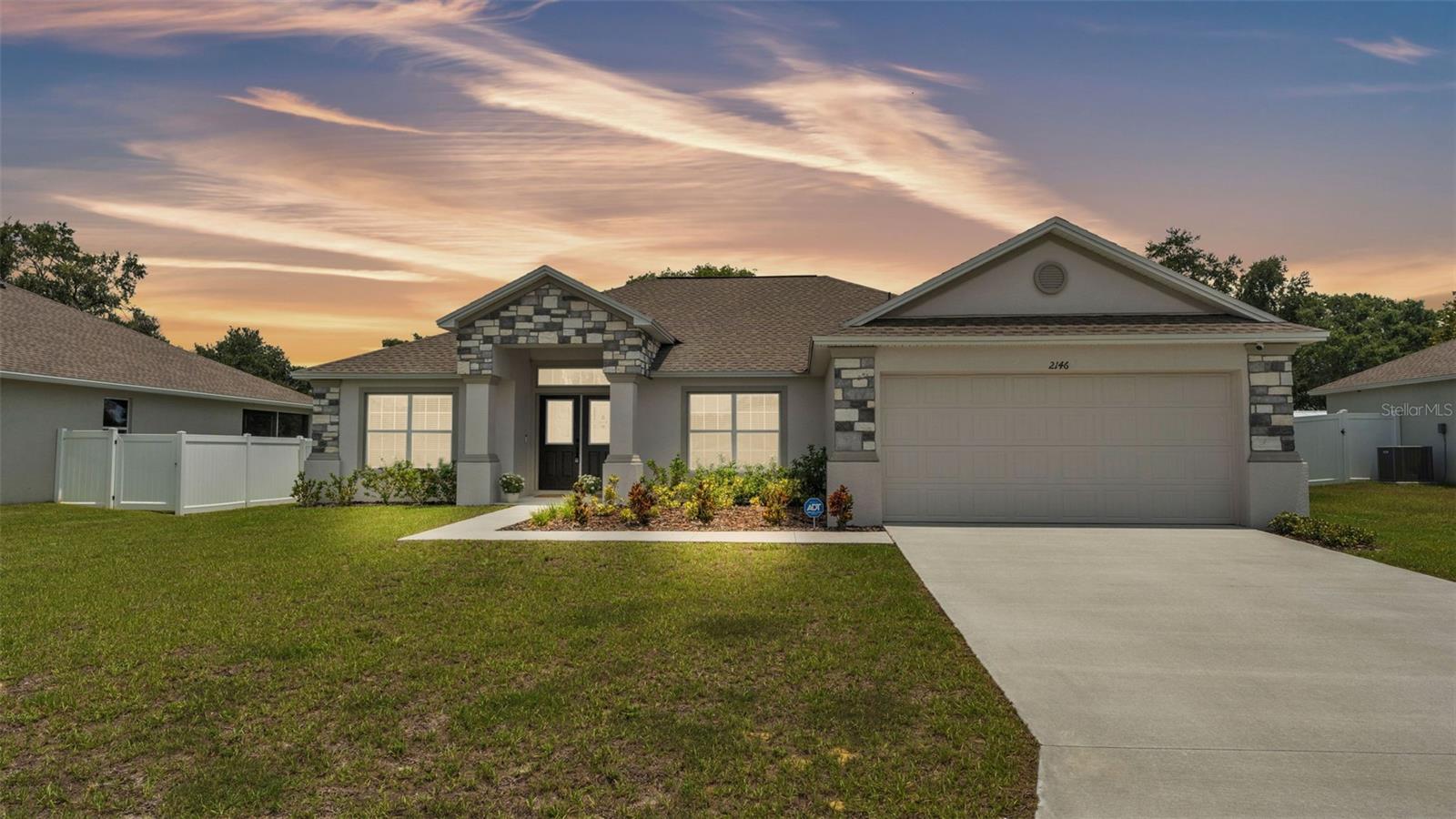 Why wait to build when this beautifully upgraded, move-in ready home is available now? Welcome to 2146 Hadley Rd, located in the heart of Bartow, Florida — a city full of charm, history, and Southern hospitality. Built in 2023, this 4-bedroom, 2-bathroom home offers 1,878 square feet of thoughtfully designed living space to suit every lifestyle. From the moment you walk in, you’ll notice high ceilings, wood-look tile throughout the main living areas, and plush carpet in all bedrooms for added comfort.
This home features a highly desirable split bedroom floor plan for added privacy, along with a flexible layout that includes a separate formal dining room or den, an open-concept great room, and a cozy eat-in dining space just off the kitchen. The spacious kitchen is a showstopper with a large peninsula that offers bar seating, stunning granite countertops, 42-inch upper cabinets with crown molding, stainless steel appliances, and ample cabinet and counter space — perfect for both everyday living and entertaining.
The primary suite is a true retreat, showcasing a tray ceiling with crown molding, a generous walk-in closet, and a luxurious en-suite bathroom complete with dual vanities, a garden tub, and a separate step-in shower. The additional bedrooms are well-sized and versatile, ideal for family, guests, or a home office.
Step outside to enjoy the screened-in covered lanai overlooking a fully fenced backyard — perfect for relaxing evenings, weekend gatherings, or letting pets play freely. This home also includes a whole-home water filtration system, smart home features, energy-efficient construction, and an indoor laundry room for added convenience.
Located in a quiet and welcoming community with easy access to schools, shopping, dining, and major highways, this like-new home is truly better than new — with upgrades already in place and no wait to build. Don’t miss your opportunity to make 2146 Hadley Rd your forever home!
All information and property details are deemed reliable but not guaranteed and Buyer/Buyer's Agent is responsible for their own due diligence including but not limited to verifying HOA, Community Info, Rules, Leasing Requirements, Sqft, Lot Size, Room Dimensions, and Taxes.