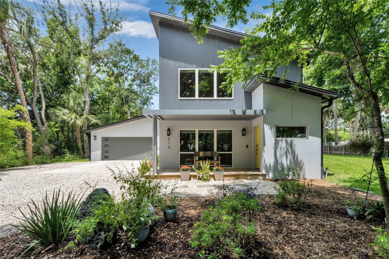 Welcome to 216 Crescent Blvd, built in August 2021! This beautiful custom-designed home on over one-third an acre is tucked away for ultimate privacy with no HOA! This mid-century modern home offers a custom kitchen with designer appliances, sleek storage space throughout, three bedrooms and two and a half baths. Once you enter the home, you will be greeted by the stunning open concept flowing with natural light with high ceilings in the living room, dining room and kitchen. The primary bedroom is on the first floor, with a shower, double vessel sinks and a walk-in closet. The laundry room and a powder room are also on the first floor. Upstairs, a loft and full bath await adjacent to two bedrooms, both with walk-in closets. Whether you are entertaining or relaxing in the living room or in the Florida room, you can enjoy Central Florida's natural beauty as the property attracts an assortment of butterflies and birds. The oversized garage has an RV hook up for you or your visitors. When you want to get out, just get in your golf cart - this home is only 5 minutes from Sanford Marina on Lake Monroe, parks and restaurants in historic downtown Sanford. Call your real estate agent today, your hidden oasis awaits.