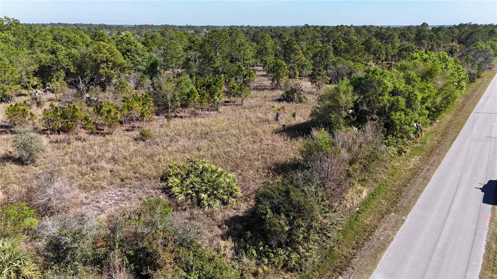 This is a perfect 5-acre tract of land, offering ample space to build your dream home along with a shop. The property boasts mature trees, providing both privacy and natural beauty, with paved road frontage for easy access. Enjoy the peace and seclusion of country living while still being conveniently close to Naples and Ave Maria.