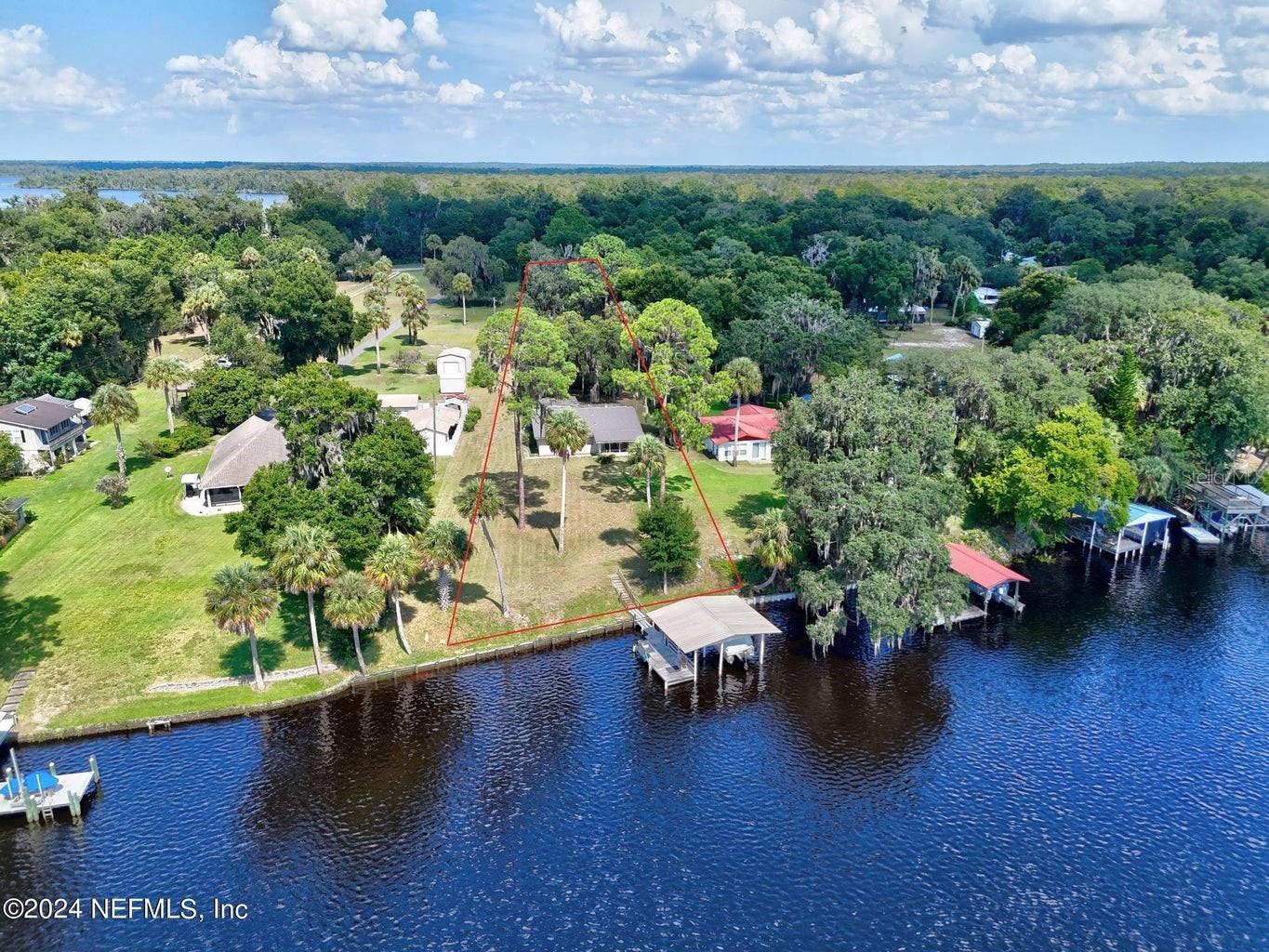 Under contract-accepting backup offers. One-in-a-Lifetime Opportunity on the St. Johns River! Don't walk—RUN—to seize this unparalleled chance to live your dream life right on the St. Johns River! Riverfront properties like this are a rare gem and seldom come available. This stunning 2-bedroom oasis offers everything you could wish for and more. Nestled on an expansive 1.62-acre lot, this property boasts a private boat dock, making it effortless to set sail and explore the serene waters at your leisure. The beautifully finished patio is perfect for unwinding and soaking in breathtaking sunsets, offering a picturesque backdrop for relaxation and entertainment. This unique home is designed for ultimate comfort and enjoyment with the tranquility of riverfront living. Properties like this are no longer being made—don't miss your chance to own a slice of paradise!