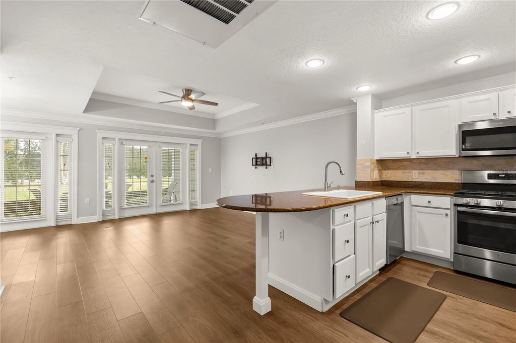 Photo of 7628 Heritage Crossing Way, Reunion, FL 34747 (MLS # O6368329)