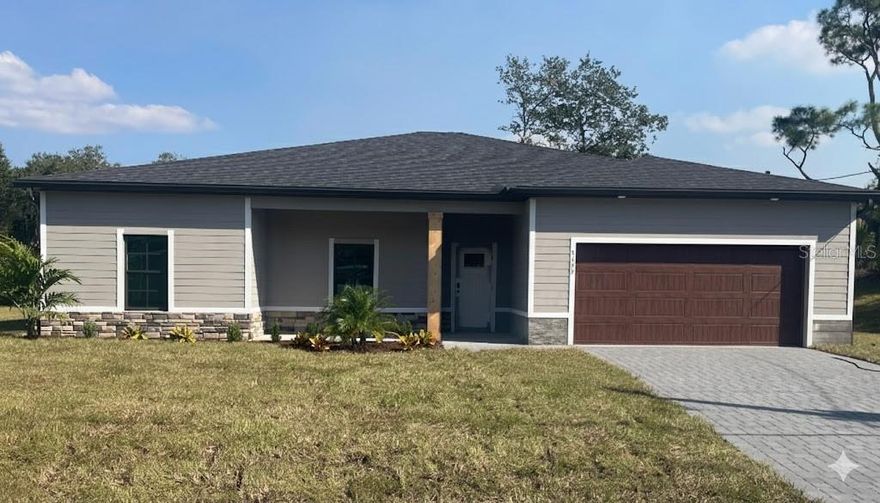 Under Construction. Tile throughout. Quartz countertops. Impact windows. Paver driveway. Whole-house generator plug. Fully upgraded new construction in North Port.

Flood insurance is not required for this property.

The layout is a 4-bedroom, 2-bath split floor plan with 2,111 square feet of living space. The open kitchen and living area work well for everyday living and entertaining. The primary suite is separated from the three secondary bedrooms, giving you flexibility for guests, a home office, or whatever you need the space to be.

No carpet anywhere. No vinyl. Tile throughout every room.

Impact-resistant windows are already in. The paver driveway is already in. The whole-house generator plug is already in. The builder did not cut corners on this one.

Buyers may be eligible for up to $5,000 in flex cash that can be applied toward closing costs or a rate buy-down.
Backed by a 2-10 Builder's Warranty.

Some photos are of the same floor plan and may not reflect current fixtures or colors in this home.