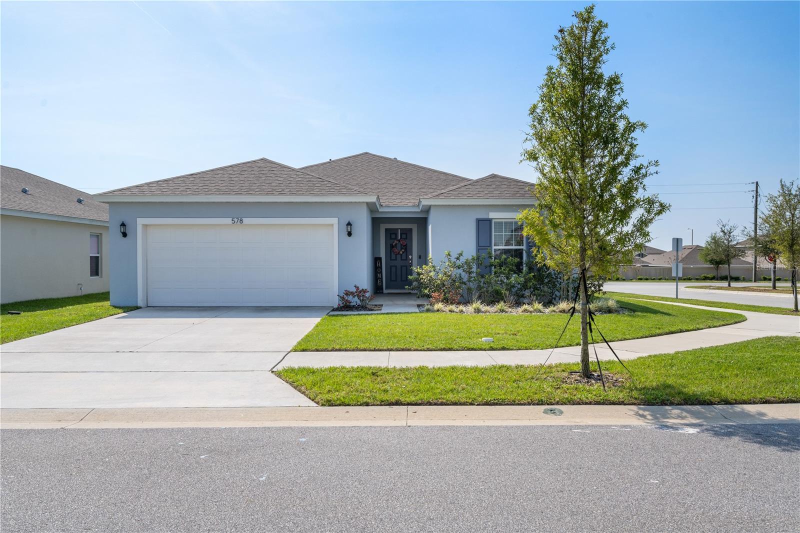 " Back on the market, Buyer failed to perform" Seller will pay 3 % of sales price toward the buyers closing costs or rate buy down. Why wait months to build. Here is a 2 year old immaculate home just for you. The four bedroom, two bath home floor plan features a 3 way split, great room concept, a wide foyer and 8'8 foot ceilings. The Kitchen has a closet pantry, breakfast bar, Island with sink so you can face the living room while cleaning up, granite countertops and a breakfast nook. The flooring in this home is all ceramic tile with exception to the bedrooms. The lovely master suite includes a large walk in shower, dual sinks, a linen closet, and a large walk in closet. This home is ideal for entertaining and family gatherings because of the great room concept, everyone can be in a large gathering space together. It also comes with a lanai, 2 car garage, and sprinkler system, upgraded carpet and padding. The community features a tot lot, park, and pool, the HOA is only 149,00 a year because the annual CDD pays for all of the amenities, common area maintenance, common area taxes and best of all it is paid in the property tax which is part of your monthly mortgage payment. The location is ideal if you need to travel, I-4 is 10 minutes away where you can merge onto the 429 and 417 for travel throughout Central Florida to the theme parks, beaches, shopping and other entertainment. Seller is ready to move!!