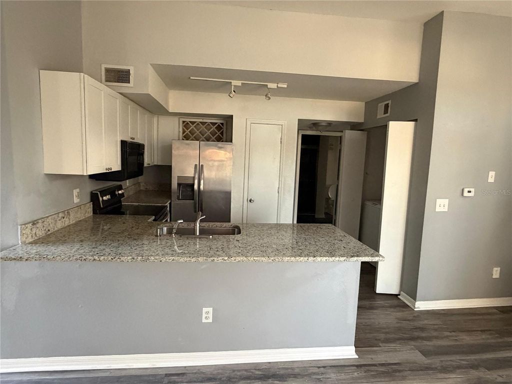 Photo of 7250 Westpointe Boulevard #1034, Orlando, FL 32835 (MLS # O6389879)