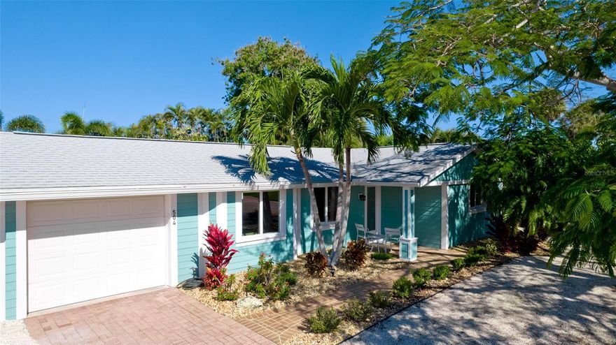 This newly remodeled open floor plan Anna Maria Island Hideaway is nestled in the heart of the island in Holmes Beach just off of Marina Drive. Just 4 blocks to the award winning white sandy beaches of Anna Maria.  This home is now offered FULLY FURNISHED as a MOVE-IN READY island dream come true.  A deeded boat slip and 13,000 lb lift can be available 50 yards from the front of the property in a canal marina as a separate negotiation.  With this home you will enjoy the “old Florida” feel of the quiet neighborhood along with the benefit of the totally private back yard and gorgeous marina water views from the front. This home has large hurricane-rated windows with Levolor Custom Sheer Shade window coverings, new ceramic tile flooring throughout, a beautifully revamped kitchen with new GE stainless steel appliances, a separate laundry room with new GE large capacity front load washer/dryer and plenty of additional cupboard storage, and newly tiled spa-like bathrooms. Comfort is assured at all times with a brand-new Carrier A/C with heat pump and smart home thermostat and a tankless water heater for never-ending hot showers. The backyard is a private tropical oasis featuring an updated and heated saltwater pool with new pool heater and salt chlorinator, a top of the line 2022 HotSprings Vanguard saltwater hot tub, lush irrigated and lighted landscaping, a 6ft privacy fence surround, and a massive fan cooled and lighted tiki-covered paver patio for outdoor TV and entertaining. The home exterior has updated HardiePlank siding, a 2019 roof, and beautifully landscaped yard along with the marina canal views right across the street. Just a short 4 block walk to the Gulf beaches and close to everything that makes Anna Maria Island great: top restaurants and pubs, free Island Trolley, boutiques, and all the beach and cart-riding fun you can handle to provide the ultimate island living experience. Finally, and very importantly, this home has no HOA, no Master Association, no CDD fees, and can be (is currently) Homesteaded to keep property taxes manageable.  Schedule your personal showing today.