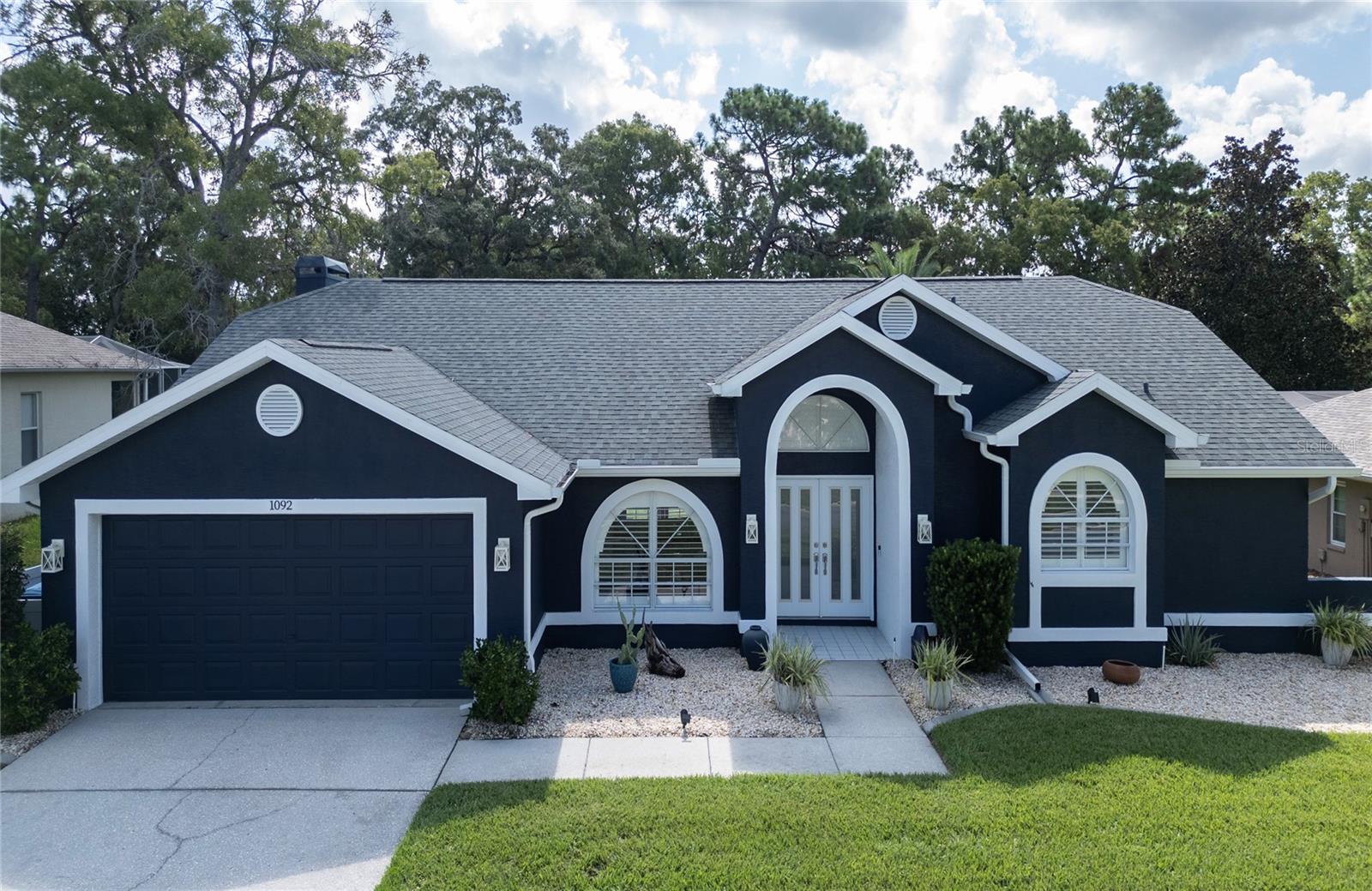 Centrally located 3-bed, 2-bath pool home just 45 mins to Tampa Airport and close to shopping, dining, and Weeki Wachee Springs. Split floor plan with sliders from both master and guest bedrooms to screened pool deck. Formal living room opens to covered lanai. Eat-in kitchen with breakfast bar and pantry. Oversized 2-car garage, inside laundry, and no rear neighbors. Roof (2022), AC (2019), exterior paint (2022), pool resurfaced (2018). Move-in ready and priced to sell—schedule your private showing today!