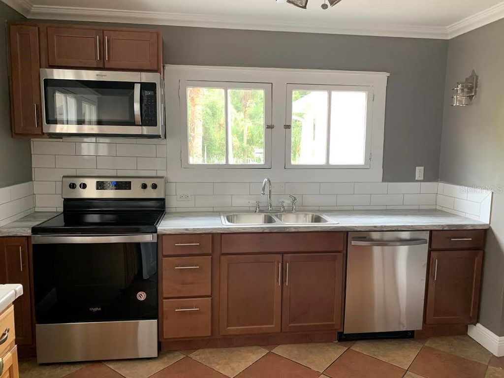 Photo of 201 E Voorhis Avenue, Deland, FL 32724 (MLS # O6422387)
