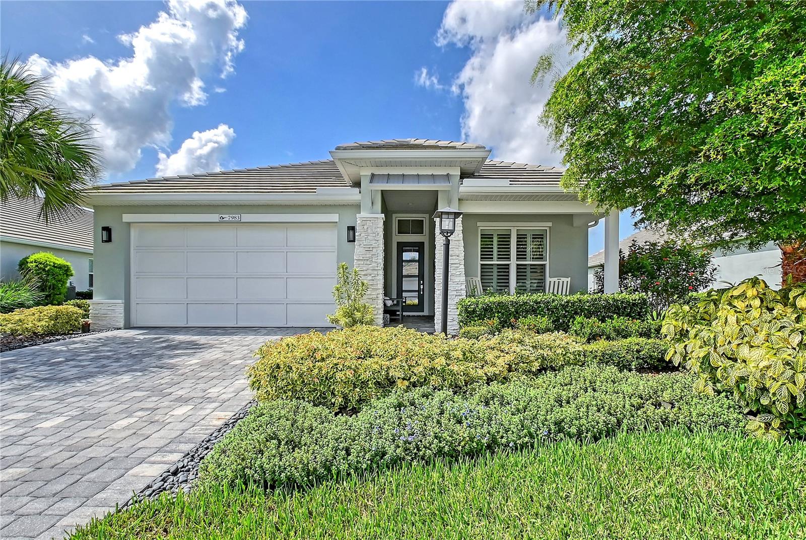 Live the luxury lifestyle in this beautifully upgraded 2-bedroom + Den, 2 bath home with a 3-car garage, located in the highly sought-after community of Lakehouse Cove. Inside, you'll find upgrades throughout with tray ceilings, great room with custom built-ins and spacious, open living areas. The chef' kitchen features a large island, walk-in pantry and ample workspace, perfect for hosting or everyday comfort. The private primary suite includes a custom-designed closet and direct, private access to the covered lanai, pool and spa - a perfect place to unwind. Th second bedroom offers its own generous walk-in closet while the flexible den is ideal for a home office or guest retreat. Impeccably maintained and thoughtfully designed, this home features a whole-house generator for peace of mind and uninterrupted comfort. Enjoy tranquil views of the lawns, boathouse and Lake Kingfisher. Lakehouse Cove's resort-style amenities are just steps away and include 6 pickleball courts, a boat house with kayaks, 2 dog parks, upscale fitness center, clubhouse with event space and a resort-style pool with cabanas and spa. This prime location provides direct access to the amenity center and is a short walk to Waterside Place, known for it's vibrant dining, shopping and community events. This the lifestyle you've been waiting for!