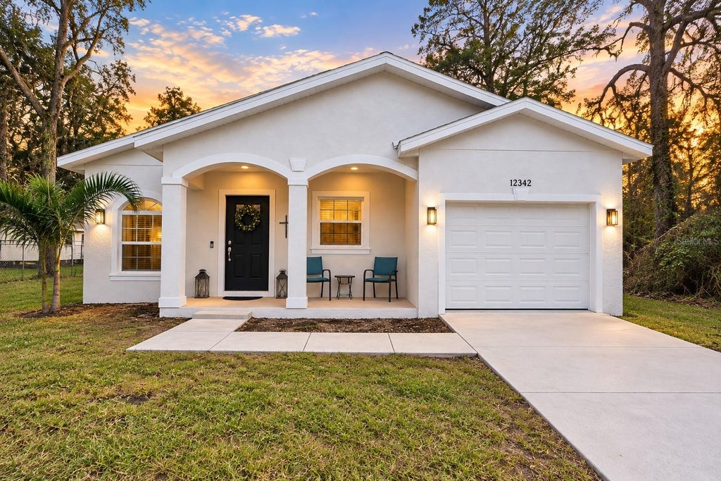 Photo of 12342 Oconee Boulevard, New Port Richey, FL 34654 (MLS # TB8546603)