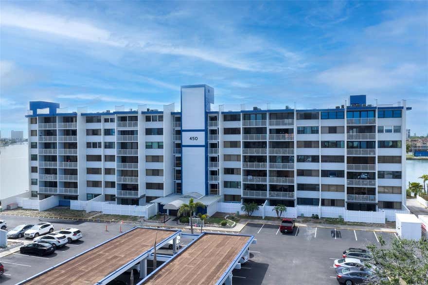 This waterfront condominium, located in the serene community adjacent to the Club of Treasure Island, offers an elegant coastal living experience. Recently renovated, the unit features two spacious bedroom suites in a desirable split-plan layout, providing both privacy and comfort. The thoughtfully designed kitchen includes granite countertops, brand-new stainless steel appliances, and efficient use of space. Additional updates include a brand-new A/C system, hot water heater, tile flooring, and hurricane-grade patio doors. Washer and dryer hookups are available for added convenience. A standout feature is the private 580-square-foot courtyard with a lush garden, offering an inviting setting for relaxing, entertaining, and enjoying the waterfront lifestyle. The courtyard also provides direct gated access from the parking lot into the apartment, making everyday entry easy and convenient. Just steps away, the Club of Treasure Island offers amenities such as a tiki bar, restaurant, pool, and potential boat slip opportunities. Beautiful beaches, dining, and local attractions are also nearby. Please note: pets are not allowed in this community. Overall, this condominium offers a wonderful blend of comfort, convenience, outdoor living, and coastal charm.
