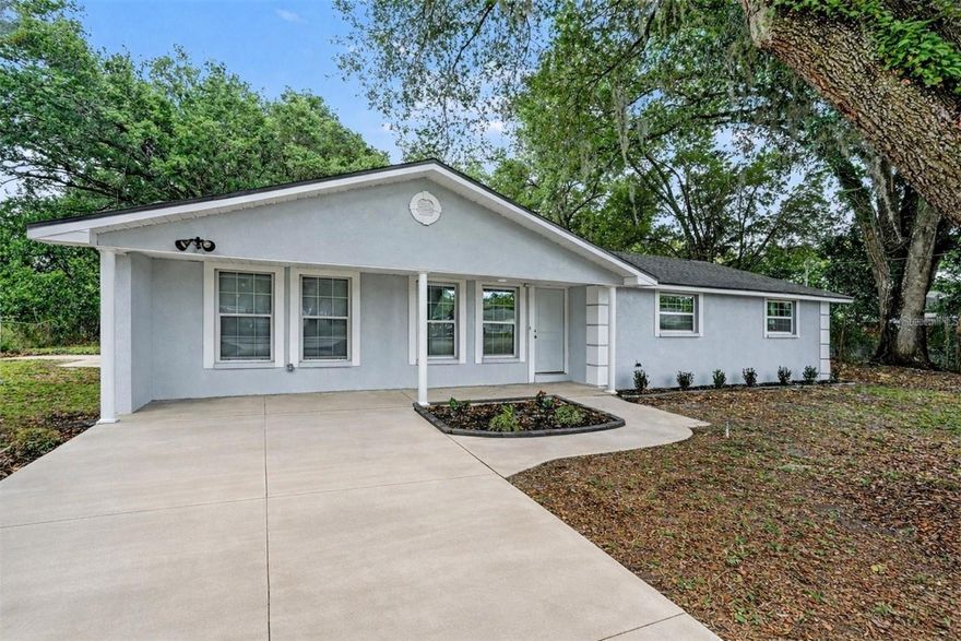 Welcome to this spectacular fully renovated 3-bedroom, 2-bathroom home with a spacious bonus room set on nearly ½ acre in beautiful Zephyrhills—where peaceful country living meets everyday convenience. This home has undergone an extreme top-to-bottom transformation, resulting in a property that now feels and functions like new construction. Enjoy complete peace of mind with major system upgrades throughout, including a brand-new roof, updated plumbing, updated electrical system, and a new water softener/filtration system—delivering the comfort, efficiency, and reliability today’s buyers demand. Inside, the bright open-concept floor plan welcomes you with an abundance of natural light, creating a warm and inviting atmosphere perfect for both everyday living and entertaining. The dream kitchen is the true centerpiece of the home, featuring beautiful new cabinetry, sparkling quartz countertops, sleek stainless steel appliances, and generous cabinet and counter space. The seamless layout allows cooking, dining, and gathering to flow effortlessly. Offering 3 spacious bedrooms, 2 full bathrooms, and a versatile bonus room, this home provides exceptional flexibility. The expansive bonus room is thoughtfully positioned on the opposite side of the home, making it ideal for multigenerational living, guest quarters, a private home office, or easily converting into a 4th bedroom. Step outside to the expansive covered lanai, perfect for entertaining or simply relaxing while enjoying Florida’s stunning sunsets. The nearly ½-acre lot offers endless possibilities and the freedom that comes with no deed restrictions—bring your boat, RV, trailer, or recreational toys, start a garden, or even raise chickens. Enjoy the tranquility and independence of country living while still being just minutes from shopping, dining, schools, healthcare facilities, and major roadways. No HOA. No CDD. And being located in-county, you’ll benefit from typically lower property taxes. This beautifully transformed home offers space, flexibility, and freedom—perfect for first-time homebuyers, growing families, or those seeking multigenerational living options with room to truly live. First-time buyers may qualify for down payment assistance programs—contact us for details. Schedule your private showing today and experience everything this exceptional property has to offer.