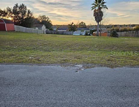 Ready-to-build lot for your mobile home! No impact fees, with a driveway apron already installed, boundary survey done, and water connection available on this spacious 0.33-acre property. Save big on this prime location in Belleview Hills Estate near Hwy 301, just minutes away from Ocala, Belleview, The Villages, and The City of Wildwood. Perfect opportunity to settle into your new home!