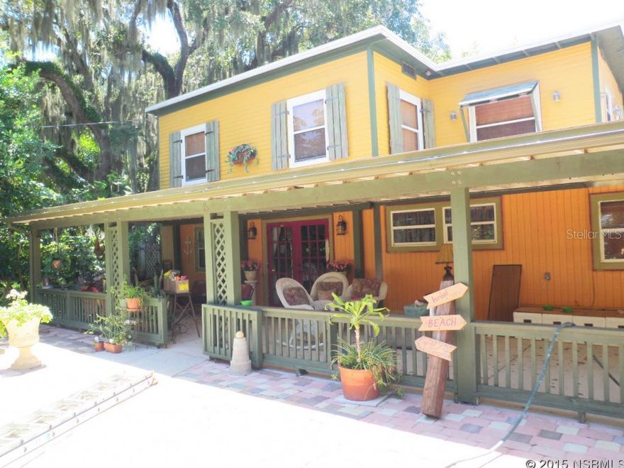 ROOM for everyone.  This Florida Style home has detached in-law suite with full bath.  Covered 2 car carport, covered porch and outdoor patio with pavers.  Outdoor shower. Upstairs has two bedrooms, bath, laundry and bonus room that could be office, studio or family room. Lots of charm and character.  Beautiful lot with nice shades trees. In-law apartment is 600 sq ft with wall heat and air. ;Water: City