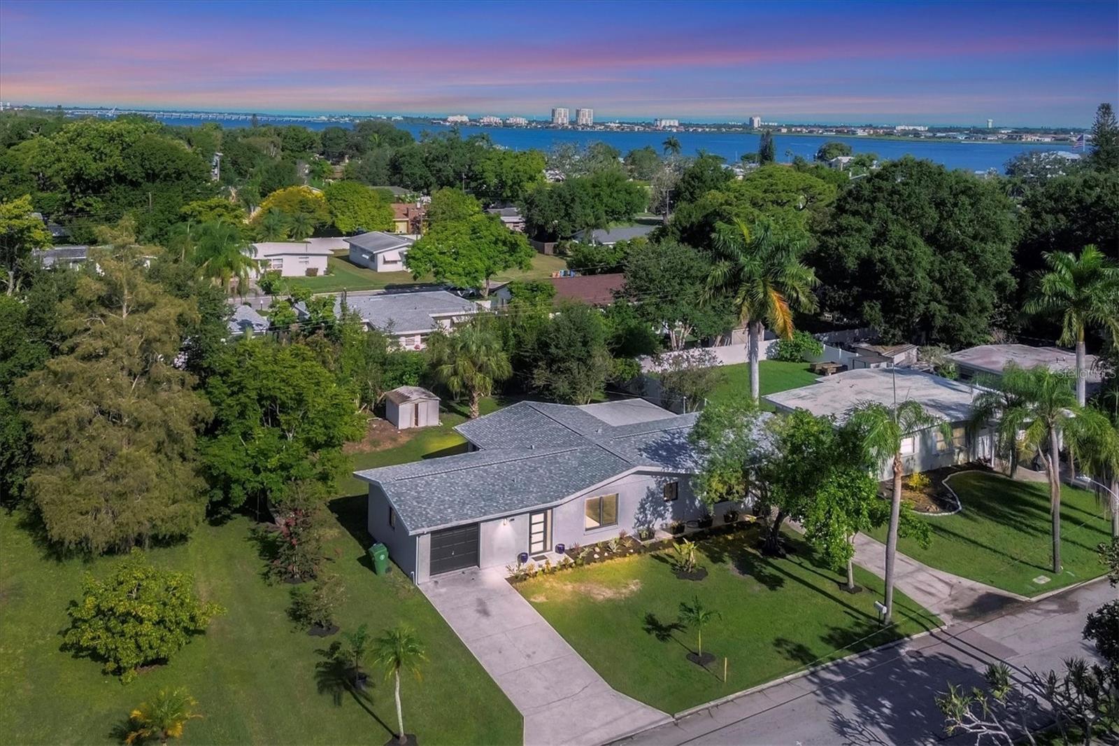 This home offers the Florida Lifestyle at an affordable price Have you always desired to be near the water, restaurants, I-75, and to be immersed in culture, then don't pass up the opportunity to purchase this home. Whether you want to go to Anna Maria Island, Sarasota, Tampa, or just down the road to the City of Bradenton this home is conveniently located to access these areas. Beautiful Terrazzo floors, open floor plan with a 3rd bedroom that could also be used as a family room. New kitchen cabinets with gorgeous white quartz countertops. Kitchen boasts stainless steel appliances with a cooktop and built in oven. Each bedroom has its own attached bathroom. Modern tasteful finishes make this home a must see. There is a 1 car garage and a carport on the opposite side which could potentially be enclosed as a lanai. Nice size yard to entertain with family and friends or if you are just looking for a larger lot for pets to enjoy the outdoor space.