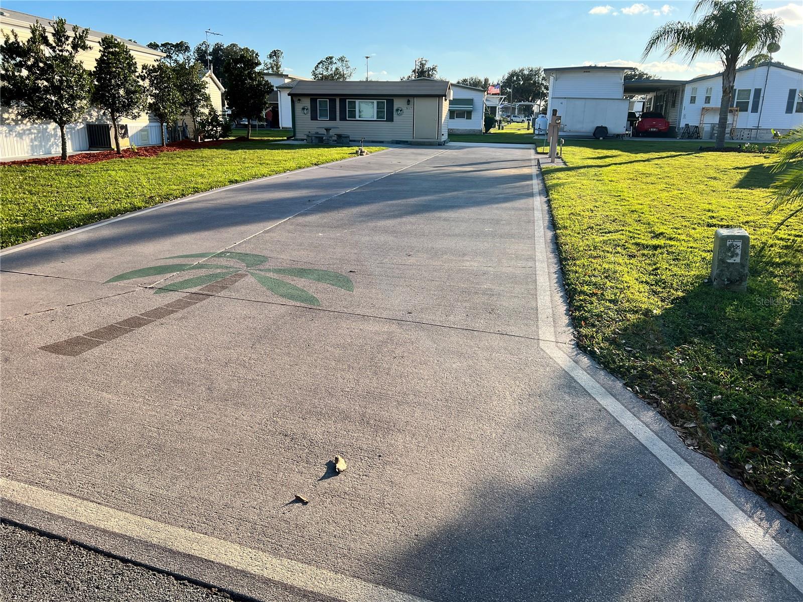 Discover the ultimate destination for Class A motorhome enthusiasts at this magnificent 45' x 102' lot in Phase 1 of Mount Olive Shores. This prime property features a vast concrete slab, perfectly designed to accommodate any size Class A motorhome. Enjoy the convenience of full public utility hookups with 200 AMP service, ensuring all your needs are met.
Enhancing the appeal, this lot boasts an expansive finished air-conditioned & heated casita shed that includes a full bathroom, washer and dryer, and a cozy living area – your perfect retreat after a day of adventure. With ample space, you also have the option to add a 10' X 20' Porch or screened enclosure to the shed, a manufactured home, and an RV port, allowing for even more personalized living.
The HOA fee is a fantastic value, covering trash pickup, basic lawn care, maintenance of common areas, as well as access to gates, fences, and a wealth of community facilities. Mount Olive Shores is not just a community; it’s a friendly and secure gated haven, conveniently located mere minutes from I-4 and a variety of shopping outlets and malls. Major medical facilities, Tampa and Orlando International Airports, and the exciting attractions of Central Florida are all less than an hour away.
As a deed-restricted community specifically for Class A motorhomes, Mount Olive Shores offers a unique lifestyle. To enjoy the benefits of residency, simply own or lease a Class A motorhome for your first year of accumulated residency. Don't miss the chance to call this vibrant and welcoming community home!