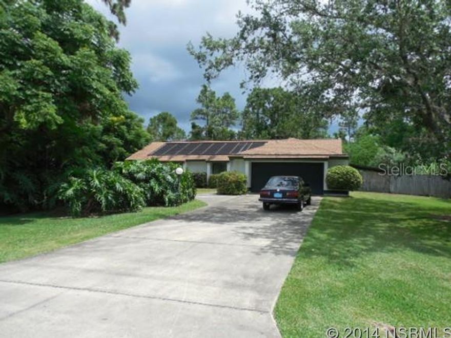 GREAT OPPORTUNITY TO LIVE IN BEAUTIFUL-WUIET NEIGHBORHOOD IN A COUNTRY SETTING, YET CLOSE TO EVERYTHING YOU USE: RESTAURANTS, SHOPPING, GAS STATIONS, I95, BEACHES, RIVER.  WELL CARED FOR HOUSE IS READY TO NEW OWNER TO MAKE IT YOUR HOME.  4/3/2 CAR GARAGE BLOCK HOME WITH A SALTWATER SCREENED POOL W/SOLAR PANELS.  ON 1.99A.  PROPERTY IS FENCED AND HAS TWO OUT-BUILDINGS W/POWER PERFECT FOR YARD EQUIPMENT OR THE HANDY MAN OR CRAFTY WOMAN. MASTER HAS LG WALK-IN CLOSET AND GARDEN TUB. FORMAL DINING ROOM IN MAIN ENTRY AREA, AND 18X18 FAMILY ROOM/GREAT ROOM OFF KITCHEN AFFORDS PLENTY OF ENTERTAINING SPACE, AND HAS SLIDERS TO POOL, AS DOES THE LIVING ROOM AND MASTER.THERE IS AN IN-LAW SUITE OR ROOM FOR YOUR OLDER CHILD WITH SEPARATE ENTANCE AND 10X10 WOOD DECK.  FRESHLY PAINTED, NEW CARPET IN LR, DR, REMAINDER OF HOUSE IS TILED. INSIDE LAUNDRY. CEILING FANS THROUGHOUT. HURRICANE SHUTTERS.  2-CAR GARAGE HAS STORAGE. BEING SOLD AS-IS. YOU MAY WANT TO UPDATE.  ALL MEASUREMENTS APPROXIMATE